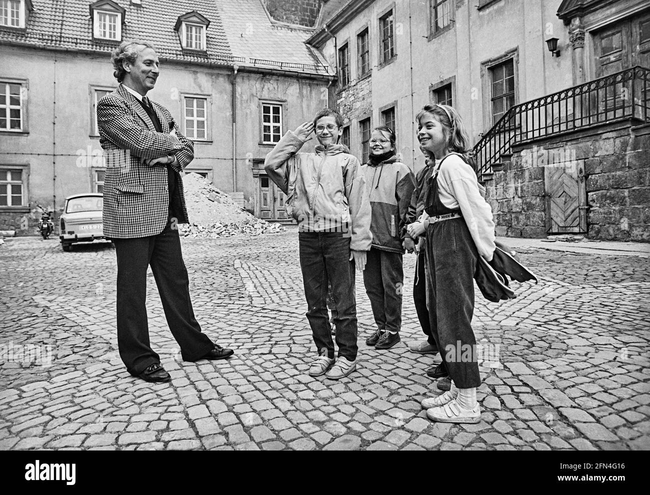 A boy salutes the welcome of Eduard Prince of Anhalt at Ballenstedt Castle. The prince is trying to regain possession of his parents' former residence Stock Photo