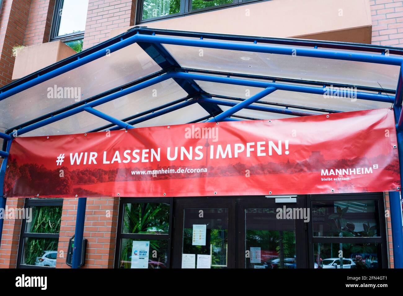 Signbord telling people to get vaccinated against Covid-19 in Mannheim/Germany. In order to stop the virus, prioritization has been lifted in strongly affected quarters. 13th May 2021. Stock Photo