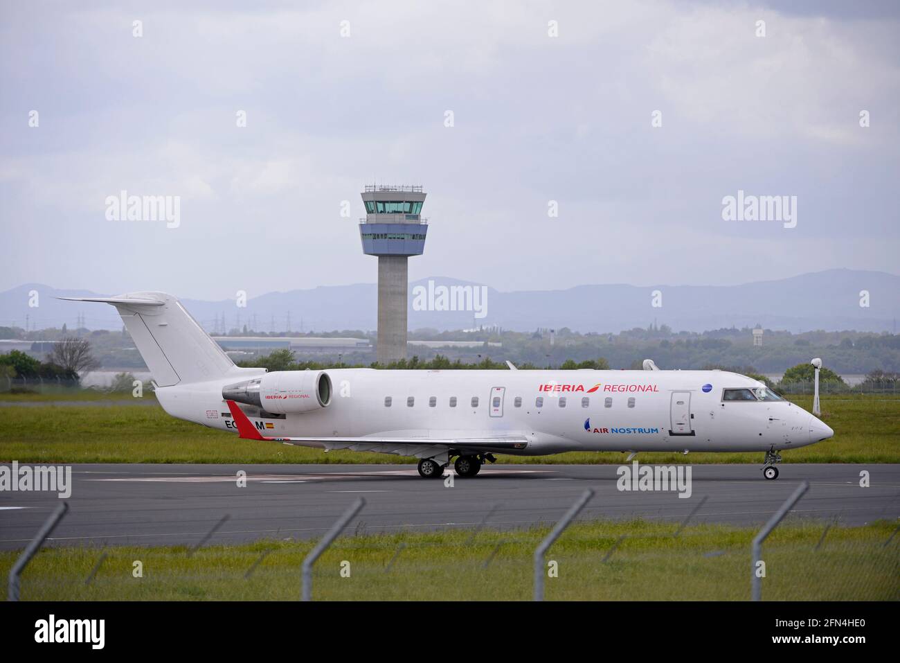 AIR NOSTRUM's ECNLM, a Bombardier CRJ200, arriving at LIVERPOOL's