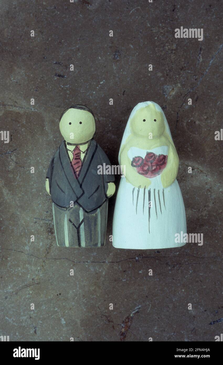Models of wedding bride and groom or father standing side by side Stock Photo