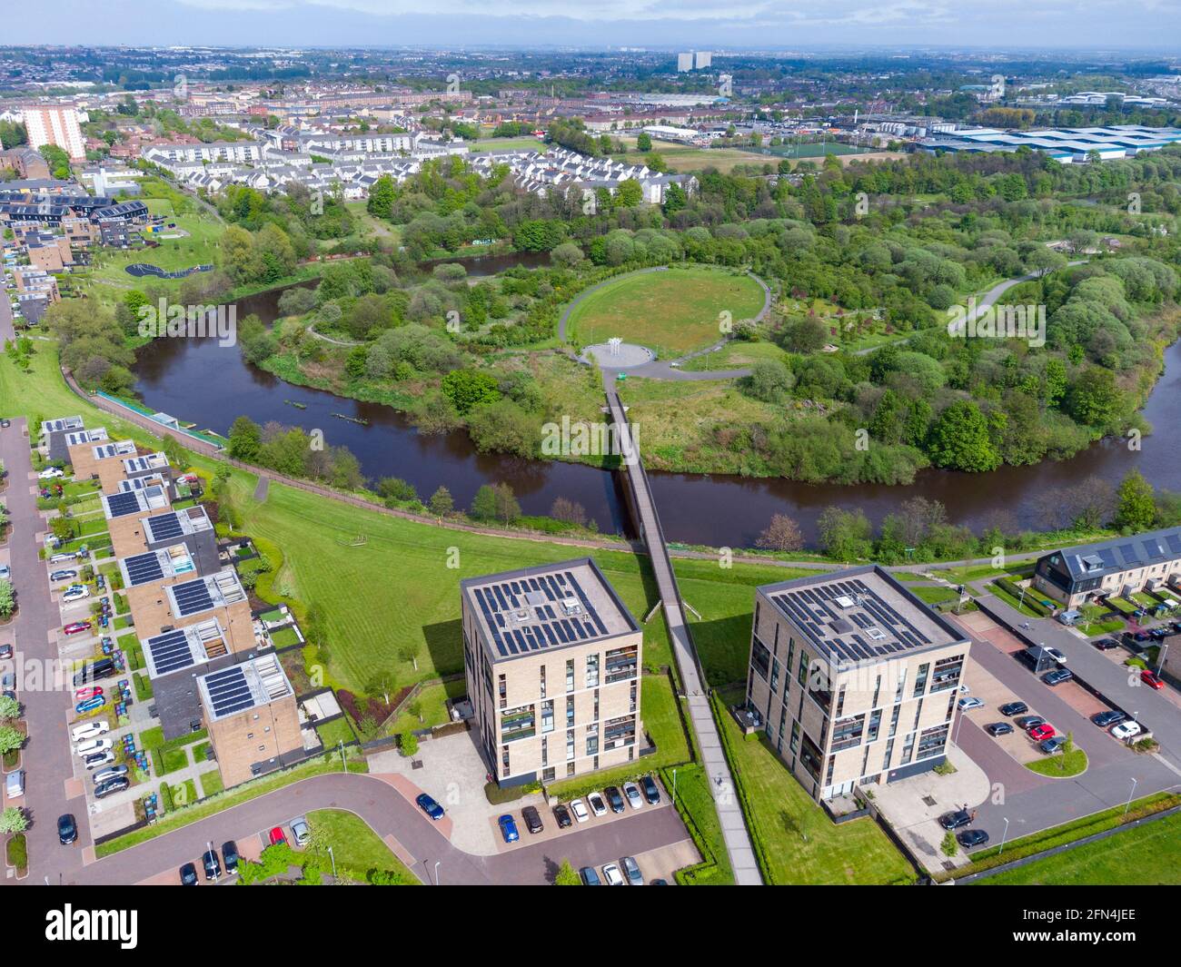 Aerial view of Cuningar Loop public woodland park and Athletes village modern housing  on banks of River Clyde at Rutherglen, Glasgow, Scotland, UK Stock Photo