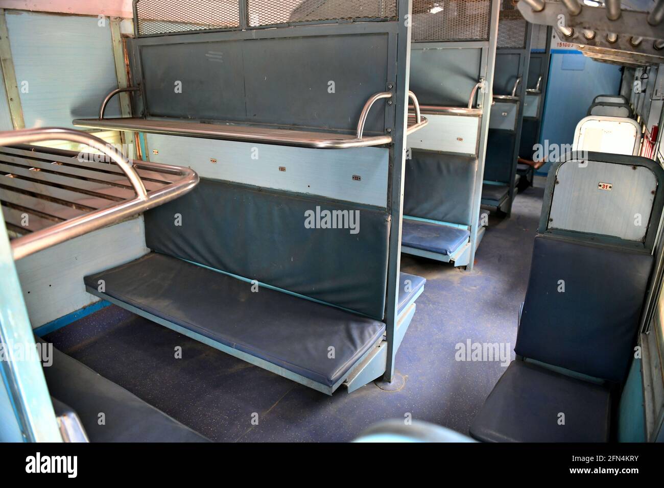 Beawar, Rajasthan, India, May 13, 2021: Dust on seats in a coach of Ranikhet Express train at station amid COVID-19 lockdown due to second wave of coronavirus pandemic in Beawar. Indian Railways cancelled several special and express trains with passenger trains over the past few weeks due to low occupancy. Credit: Sumit Saraswat/Alamy Live News Stock Photo