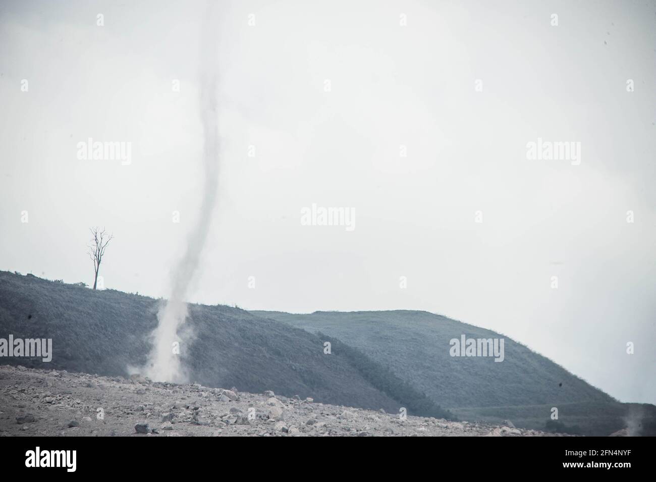 Indonesia. 14th May, 2021. Whirlwinds fly volcanic ash as an materials in the track flows of Sinabung volcano eruption. Photo taken in Simpang Empat, Karo, North Sumatra, Indonesia on May 14, 2021. Photo by Sutanta Aditya/ABACAPRESS.COM Credit: Abaca Press/Alamy Live News Stock Photo