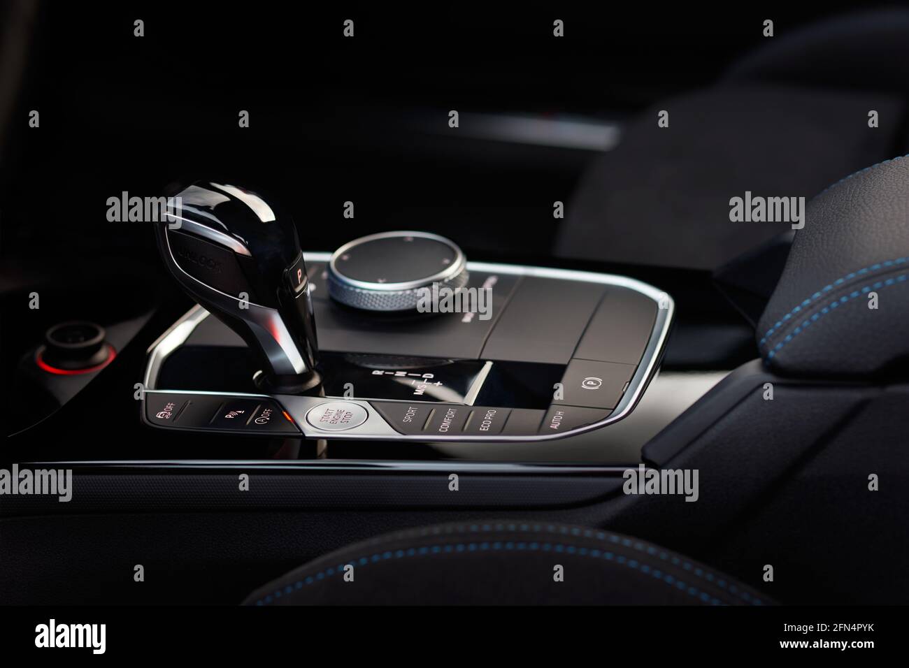 Automatic gear shift knob in a modern sports car. Black car interior. Stock Photo
