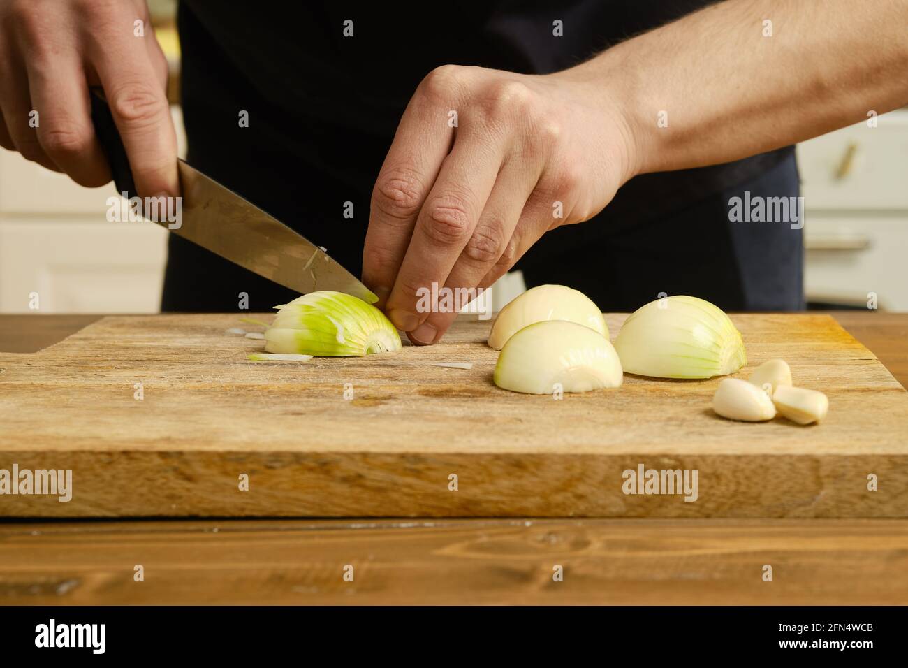Man slicing an onion hi-res stock photography and images - Alamy
