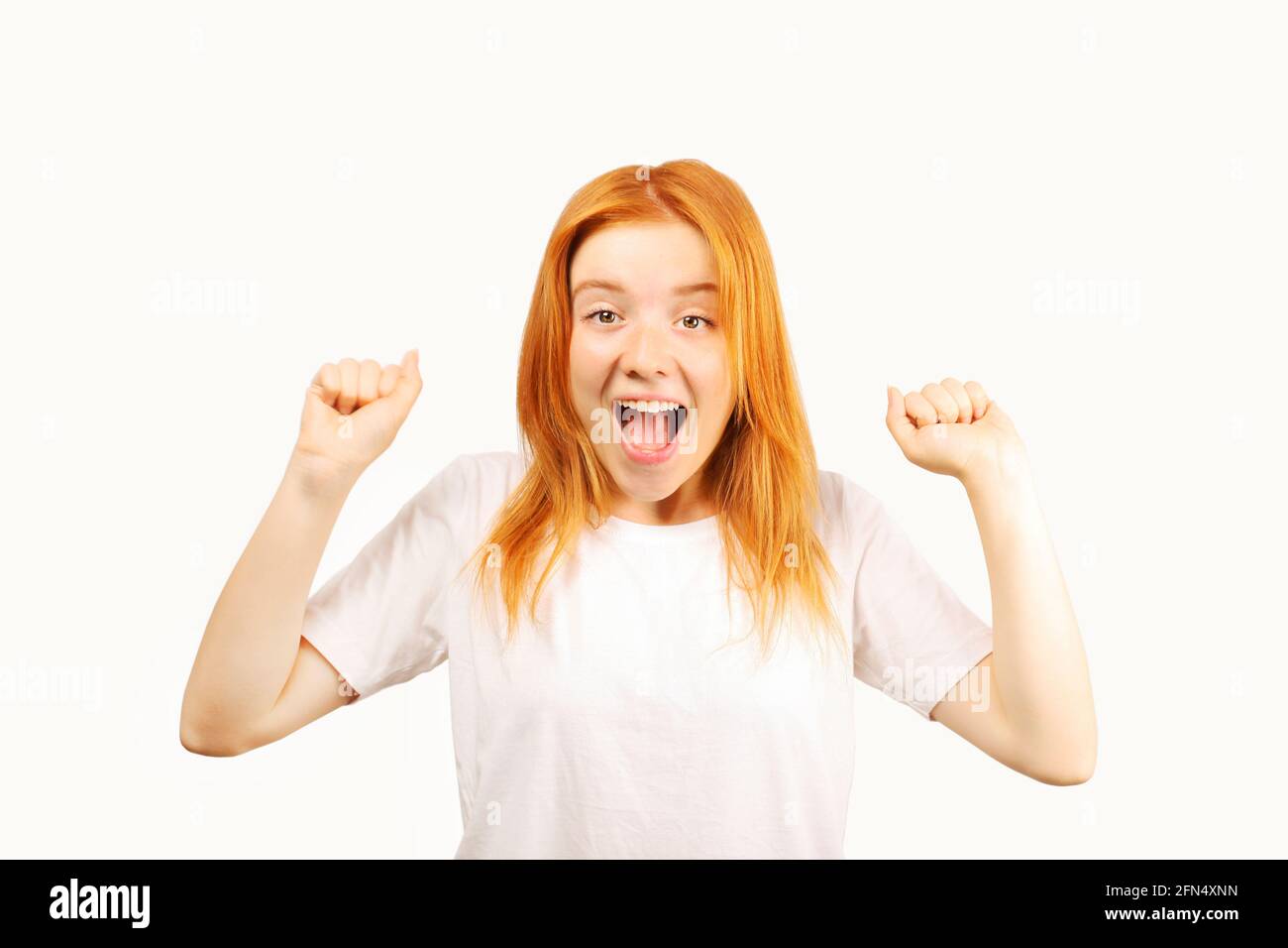 Beautiful redheaded happy young woman, rejoice w/ funny facial ...
