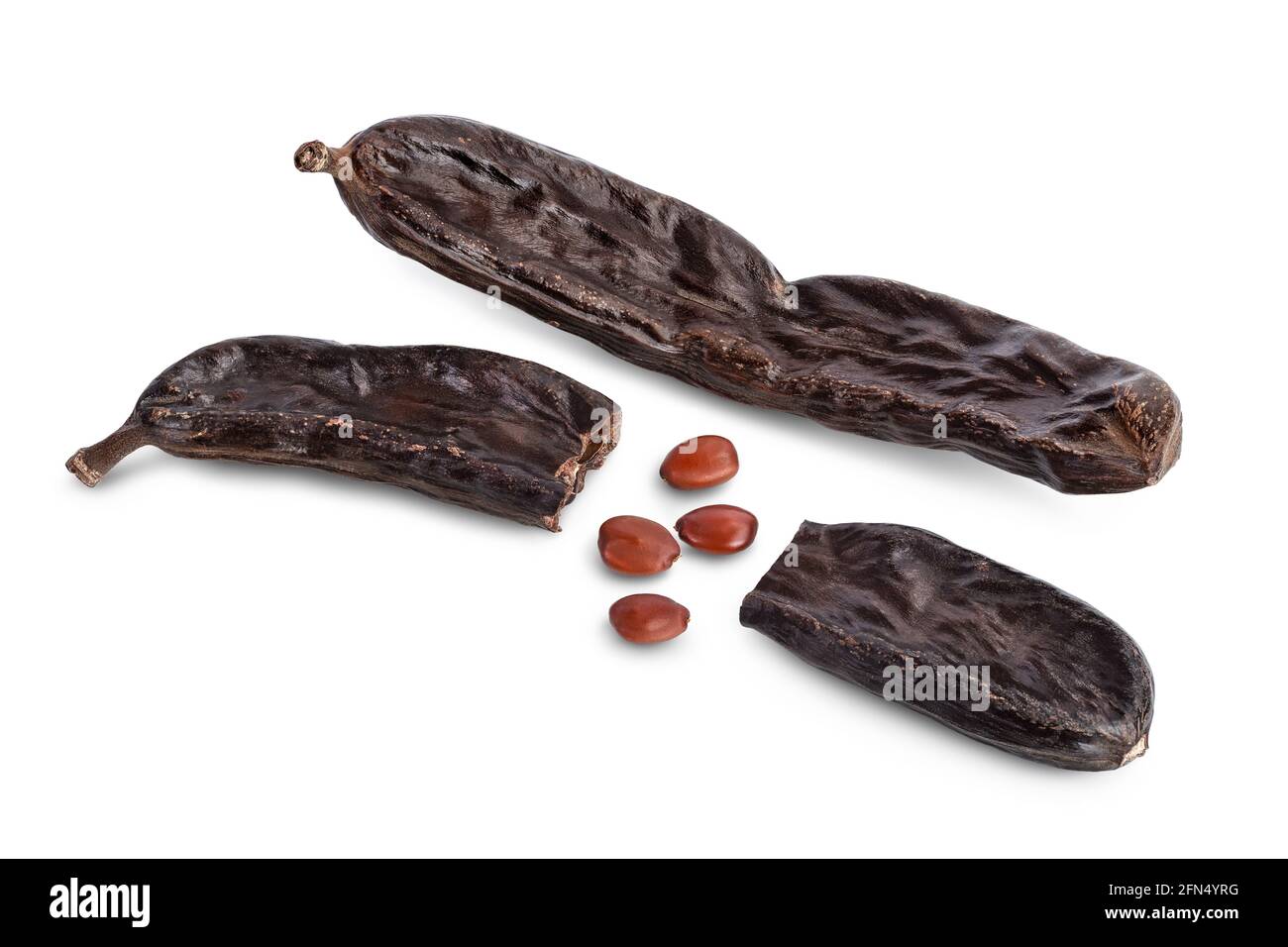 Ripe carob pods and bean isolated on white background with clipping