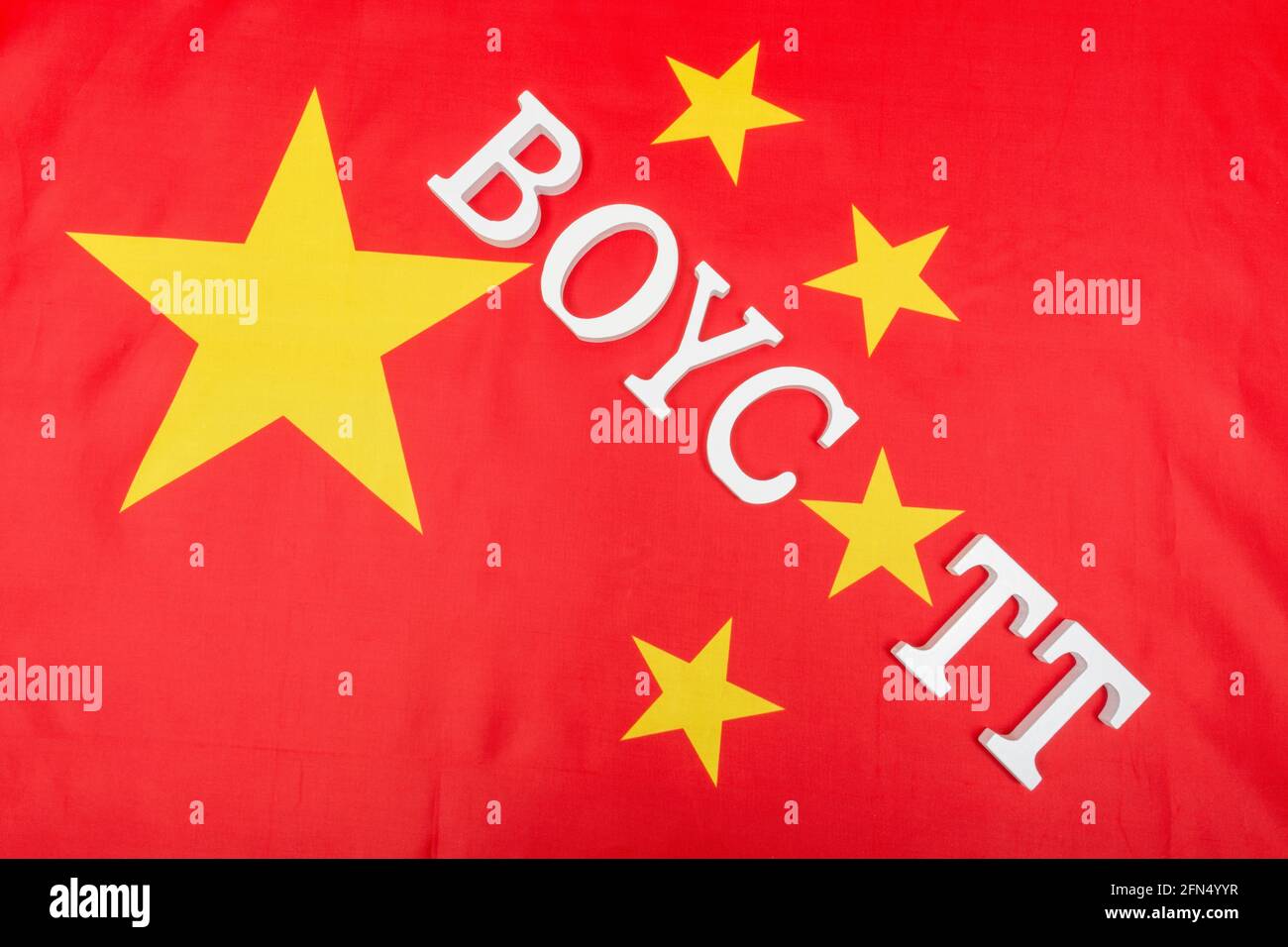 Chinese flag with letters spelling Boycott. For ban on Chinese products