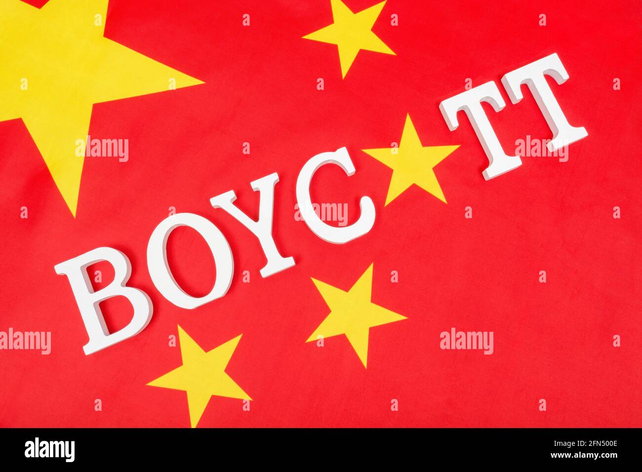 Chinese flag with letters spelling Boycott. For ban on Chinese products & goods, boycotting 2022 Winter Olympics, China boycott of Taiwanese products. Stock Photo
