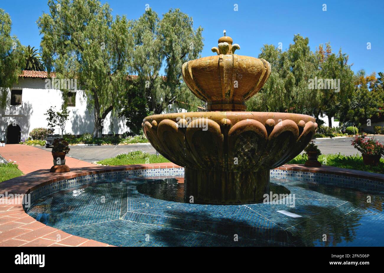 Terracotta and Talavera glazed tile sculpted fountain with a mosaic pattern  in the courtyard of the Mission Basilica San Diego de Alcalá in California  Stock Photo - Alamy, image size:1300x925