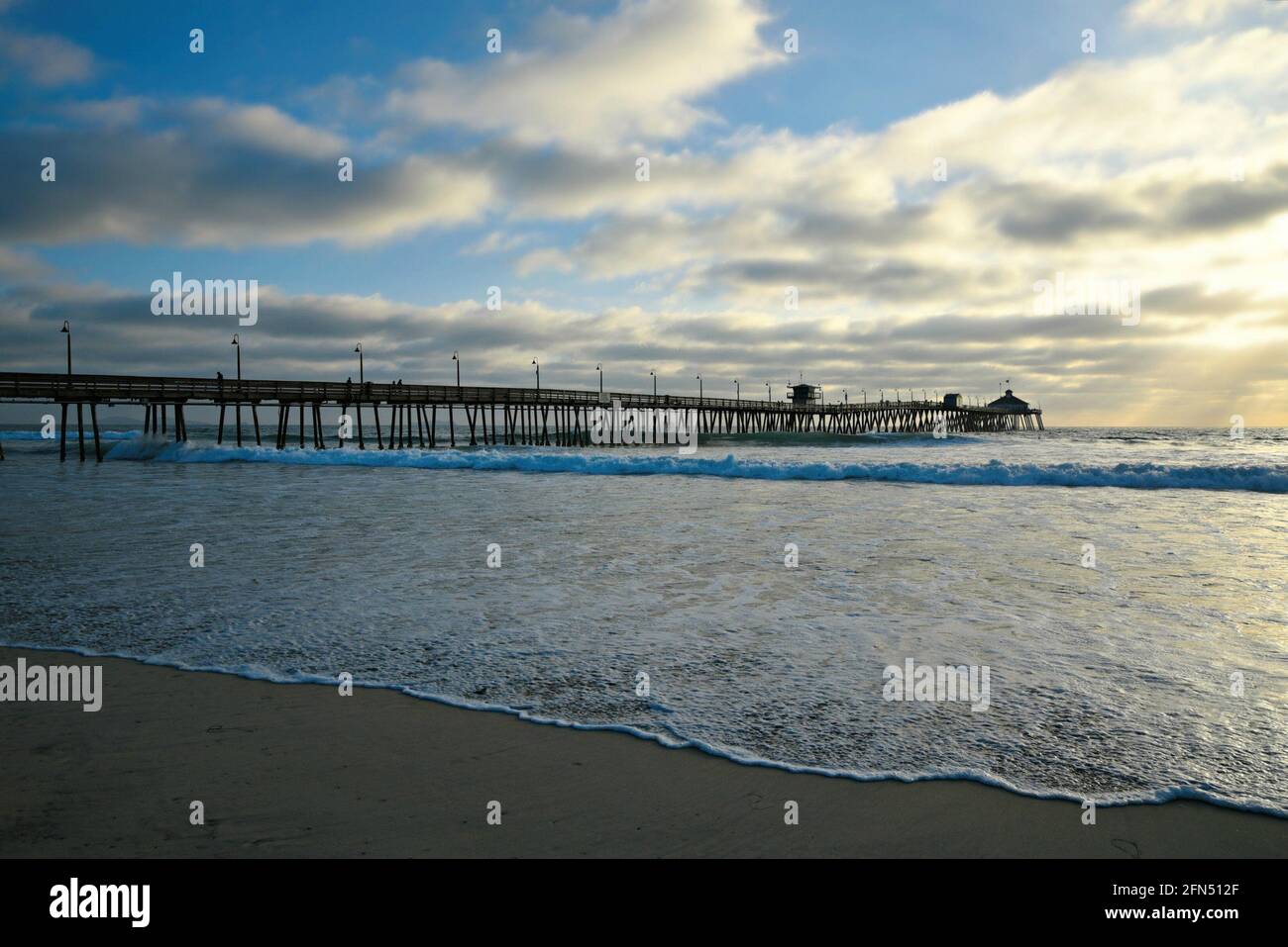 Cloudy day seascape with panoramic view of Imperial Beach Pier and the Tin Fish Restaurant in San Diego, California USA. Stock Photo