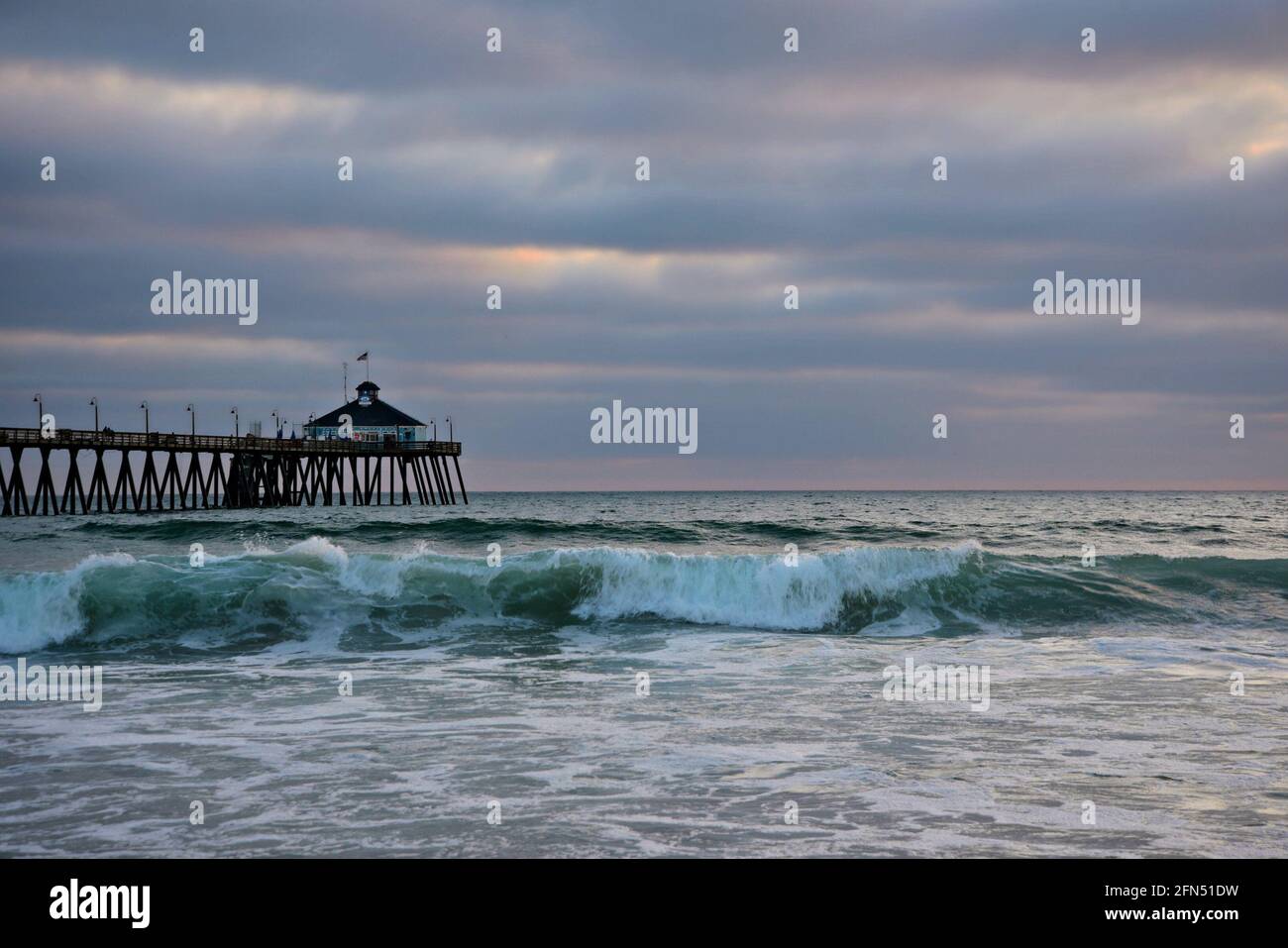 Cloudy day seascape with panoramic view of Imperial Beach Pier and the Tin Fish Restaurant in San Diego, California USA. Stock Photo