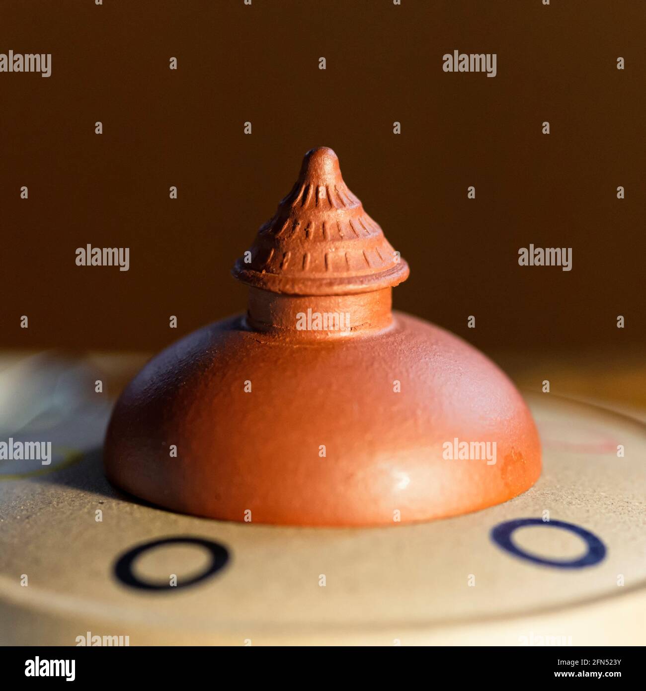 Lid of a clay pagoda-shaped Chinese teapot Stock Photo