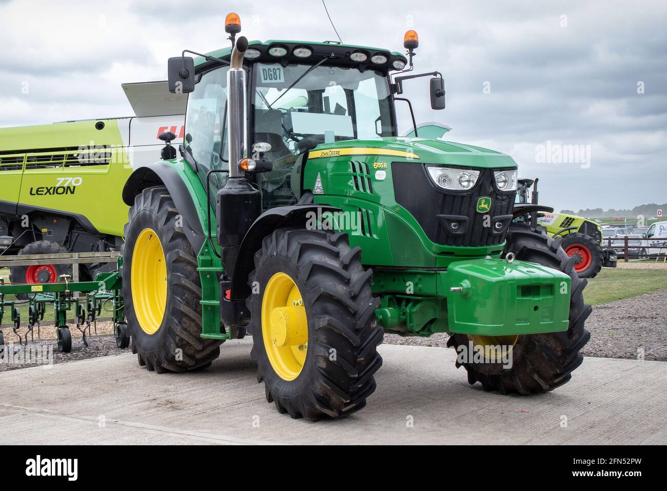 A John Deere 6155R tractor unit on display at a rural summer fair in Lincolnshire, UK. Stock Photo