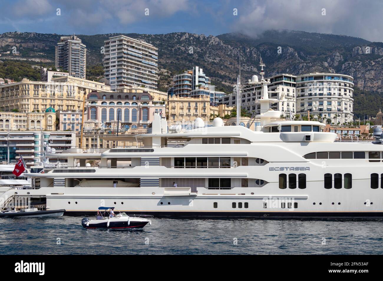 Hillsides and buildings bordering the yacht and boat marina at Monte Carlo, Monaco on the French Riviera. Stock Photo