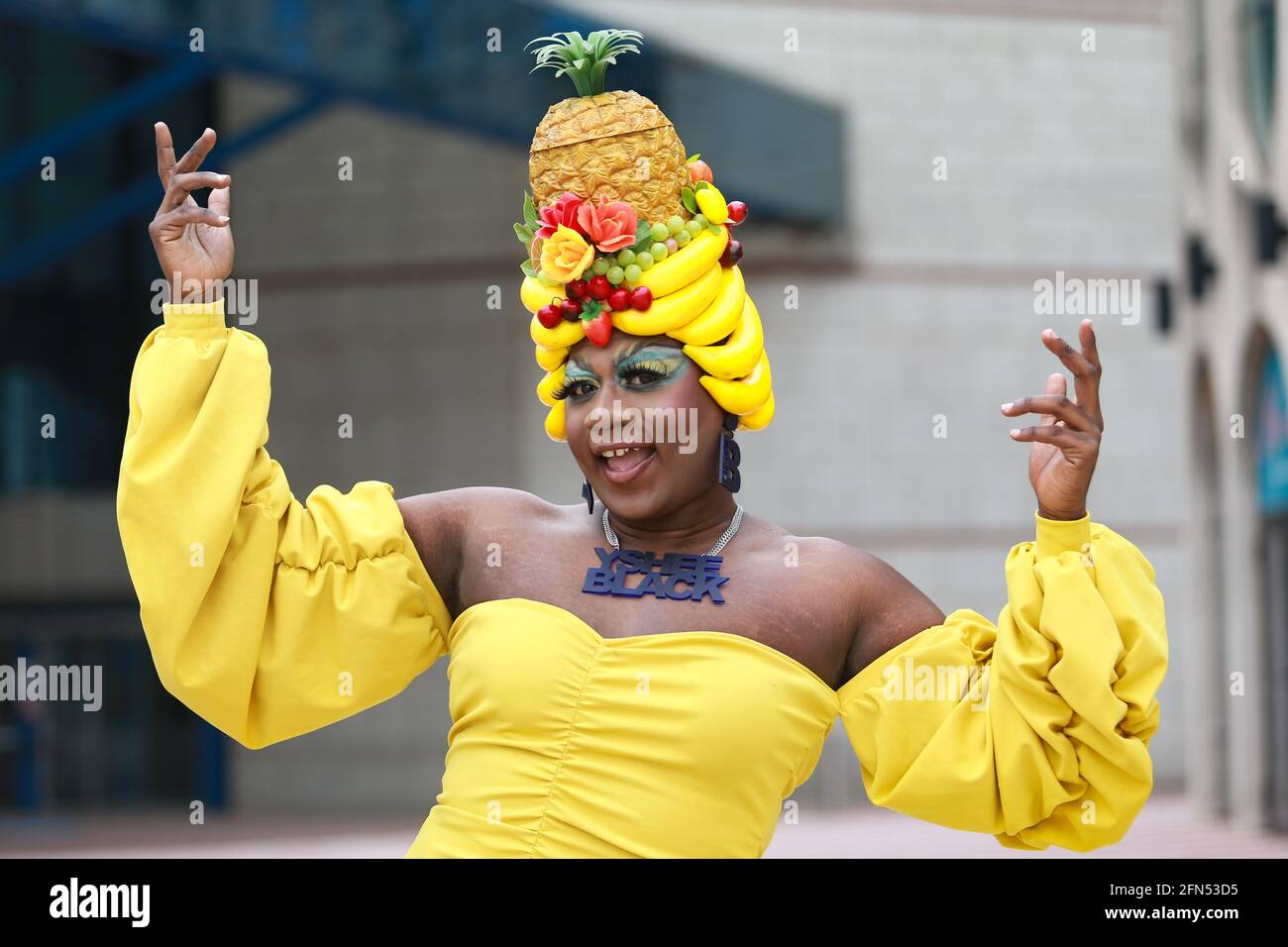 Birmingham, UK. 14th May, 2021. Drag dancers perform for the cameras as they make a film for the Birmingham International Dance Festival 21 digital summer edition in Birmingham's city centre. The film, Anywhere's a Dancefloor, is the creation of Jason Guest and drag dancer Fatt Butcher. Yshee Black poses with her extravagant headress. Peter Lopeman/Alamy Live News Stock Photo