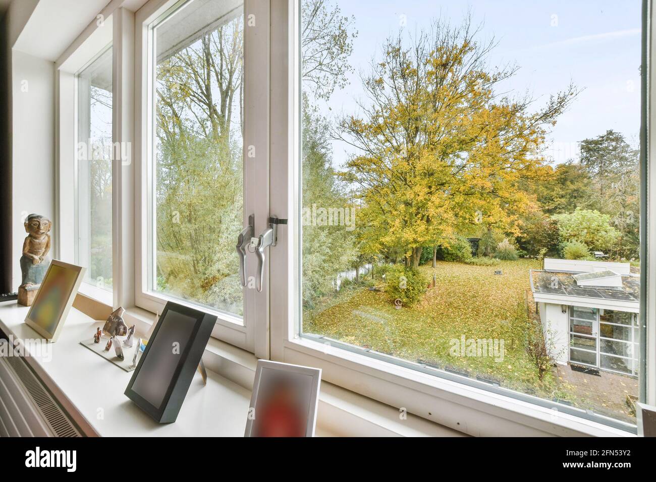 Open window to balcony viewing countryside road Stock Photo