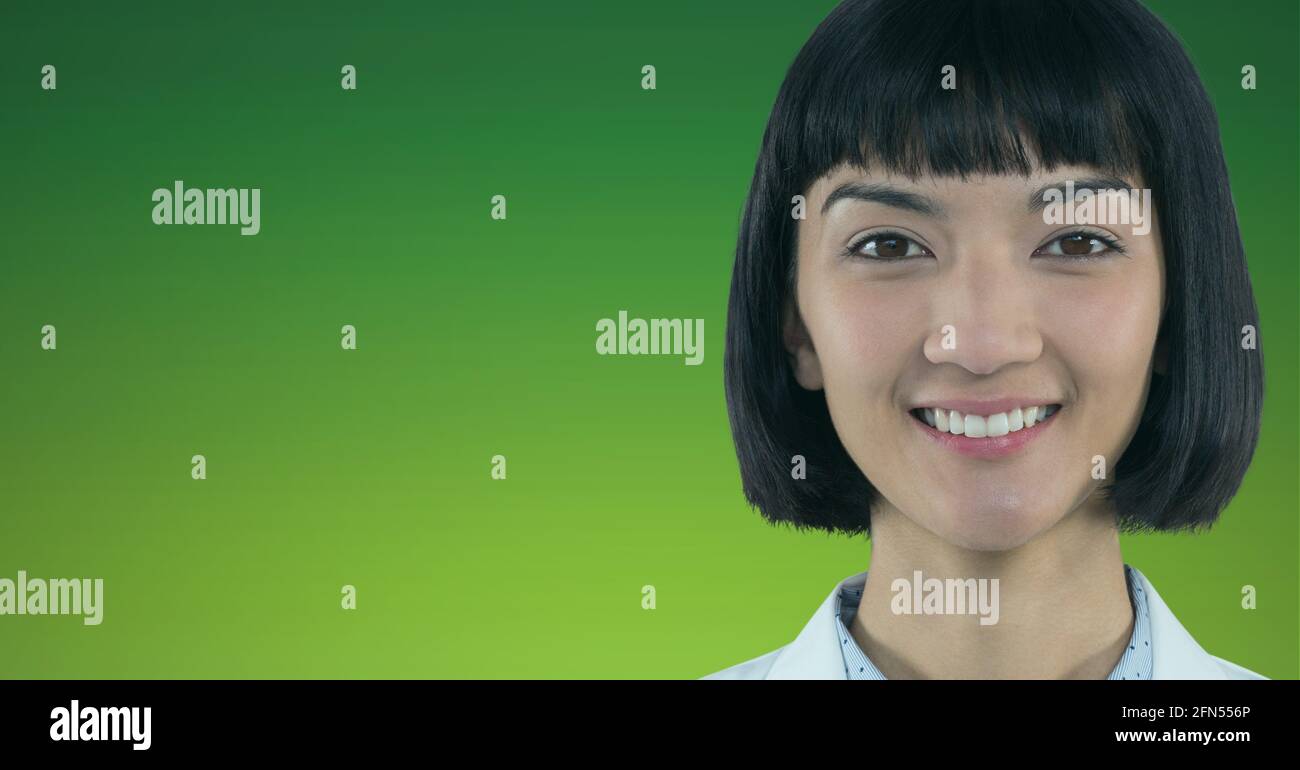 Portrait of asian female doctor smiling against green and yellow ...