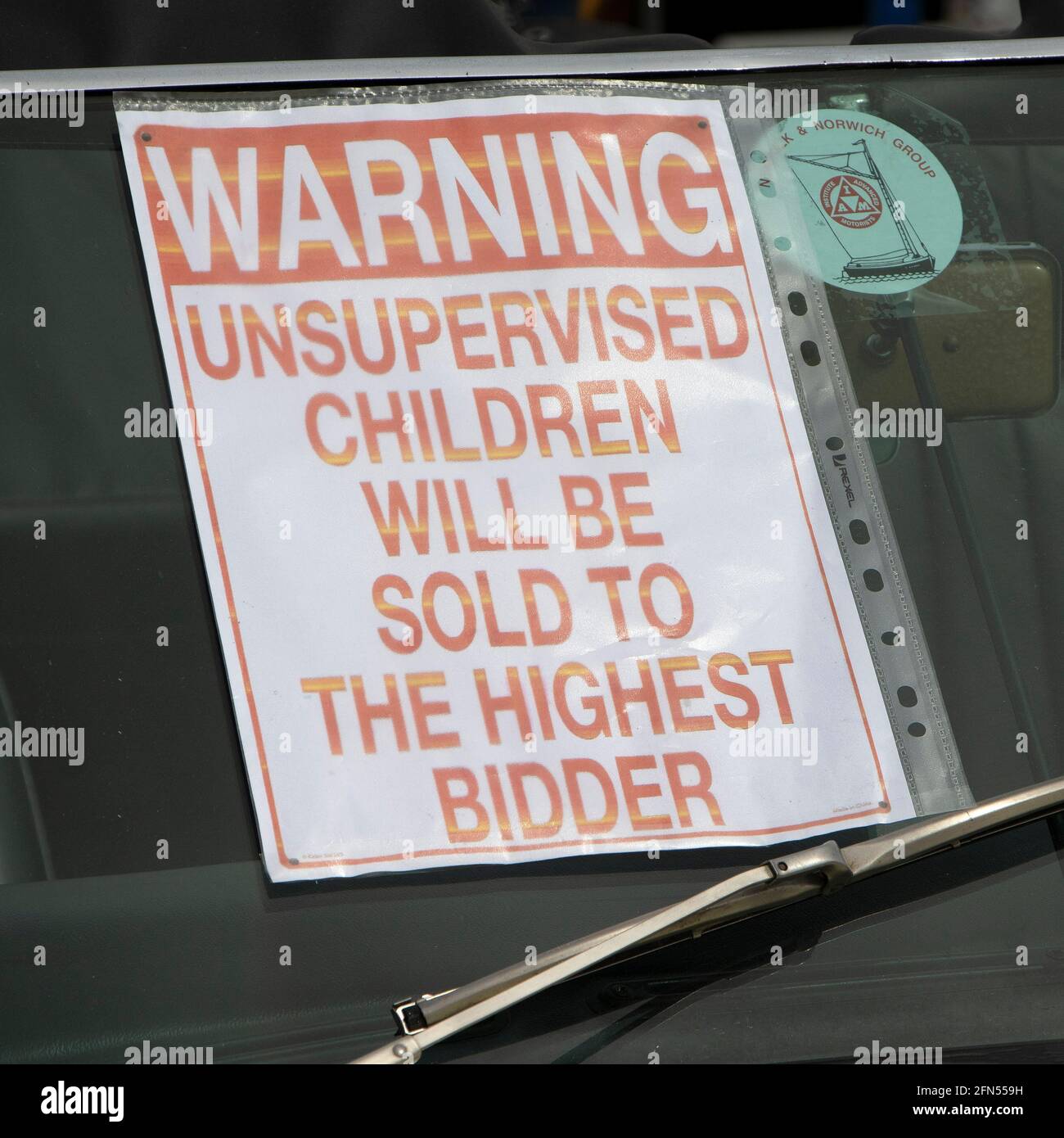 Amusing sign on the inside of a vehicle windscreen at a motor show in Norfolk, UK. Stock Photo