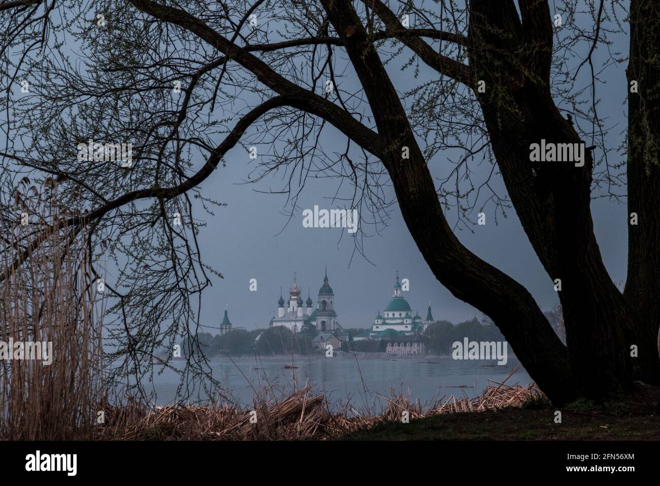 View of Spaso-Yakovlevsky Monastery in Rostov Veliky from Nero's lake on a sunset. Stock Photo