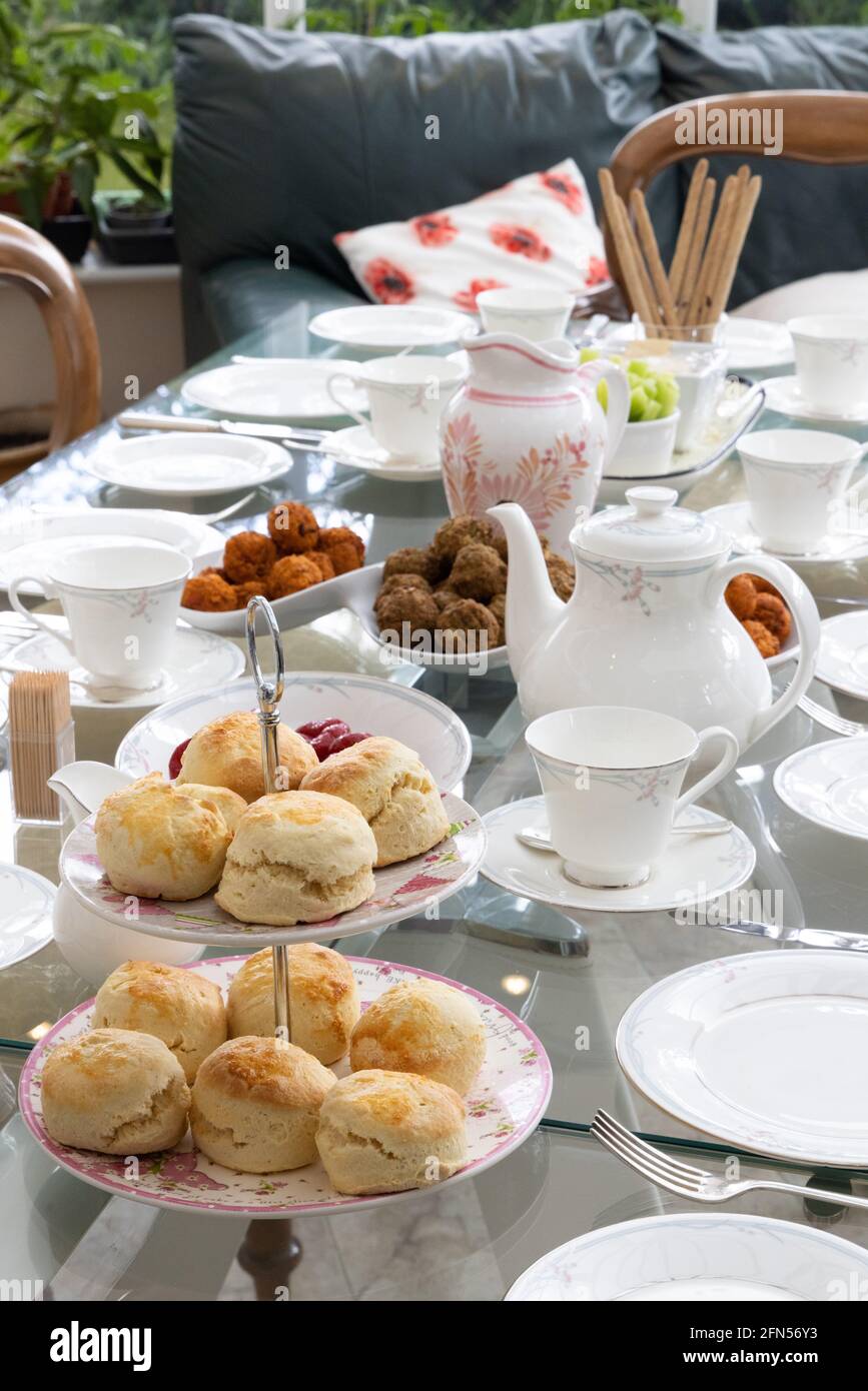 Afternoon tea UK; table set with bone china, scones and tea service for traditional English afternoon tea, Suffolk UK Stock Photo