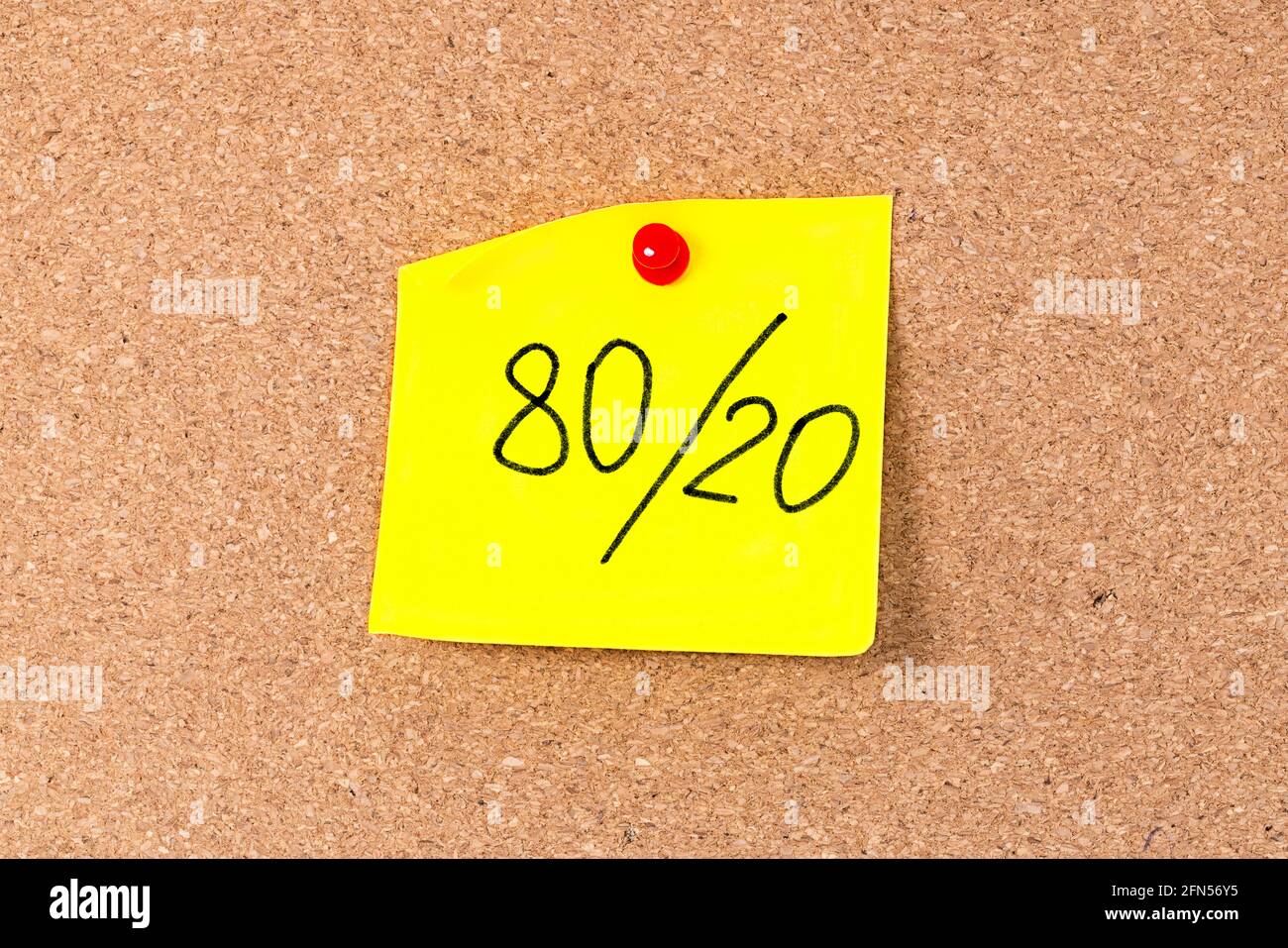 Pareto principle or 80 20 rule represented on a sticky note - a reminder or advice. Stock Photo