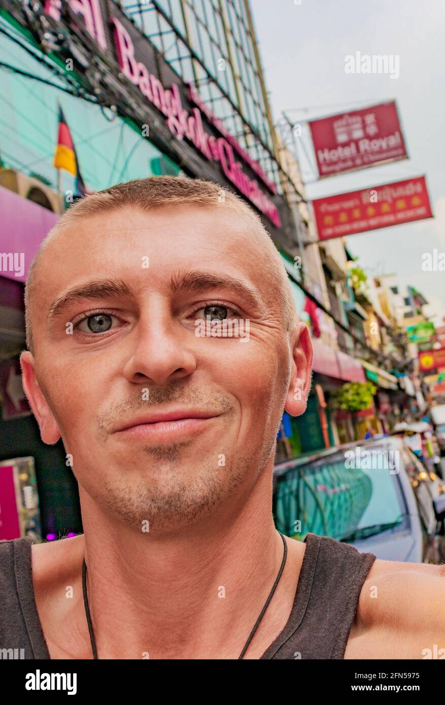 World travel backpacking in China Town Bangkok while heavy traffic. Can