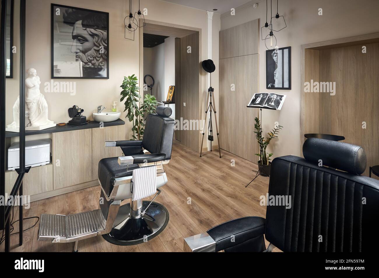 Barber shop or barbershop vintage design hair man salon empty with chair  statue portraits and photo studio Stock Photo - Alamy