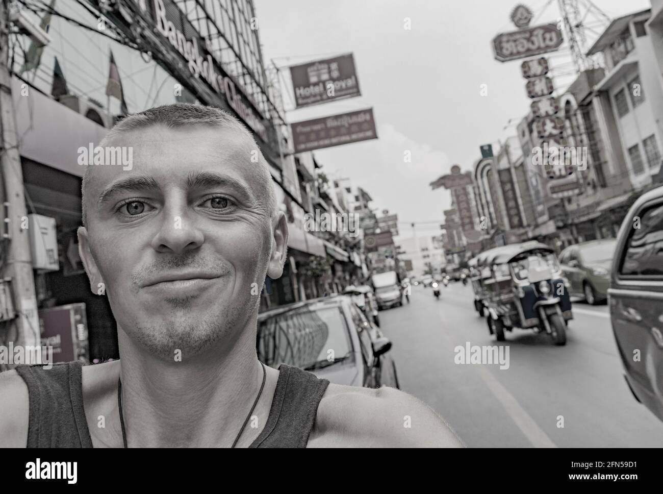 World travel backpacking in China Town Bangkok while heavy traffic. Can