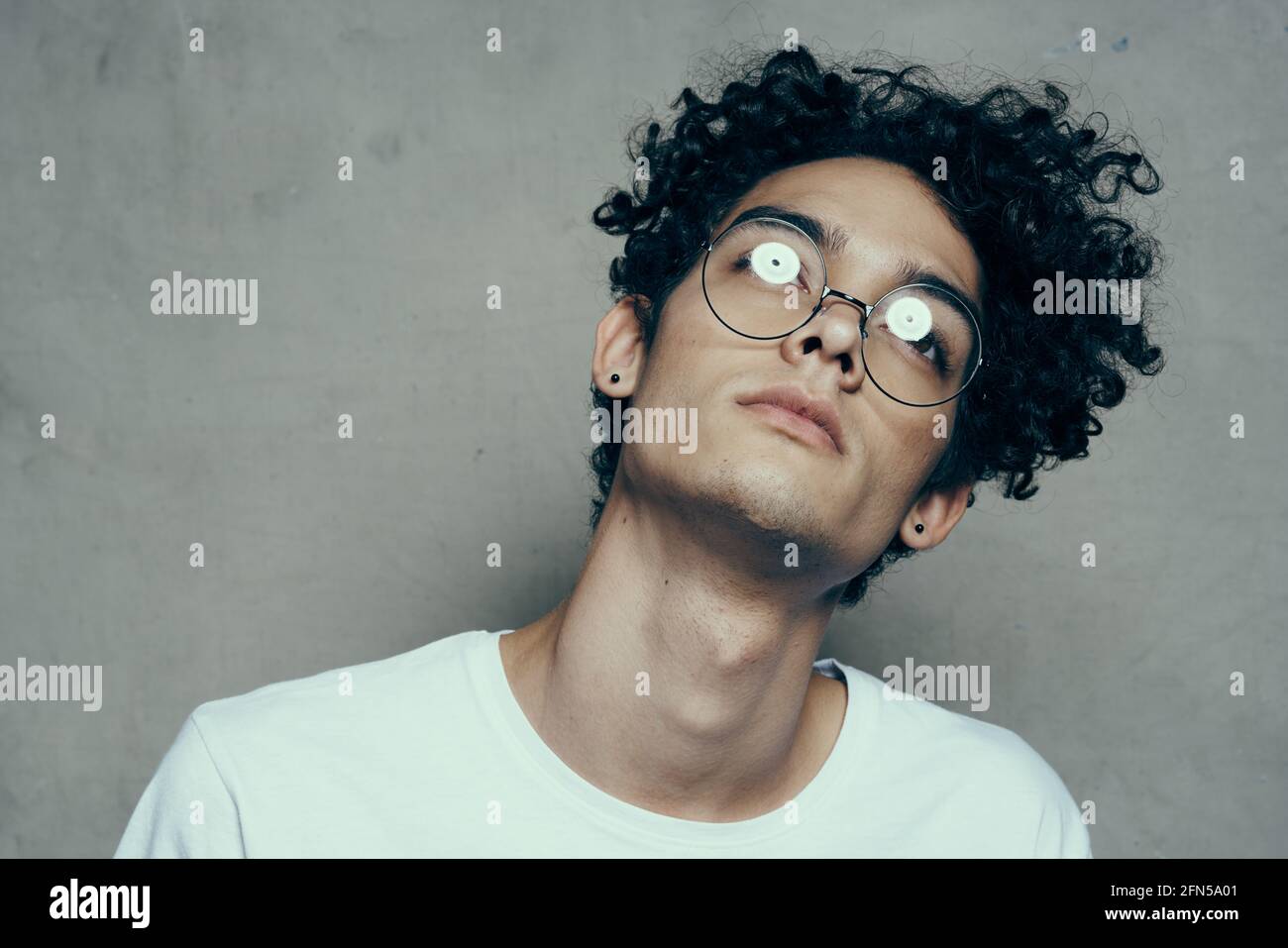 man with glasses curly hair attractive look cropped look fashion yes Stock  Photo - Alamy