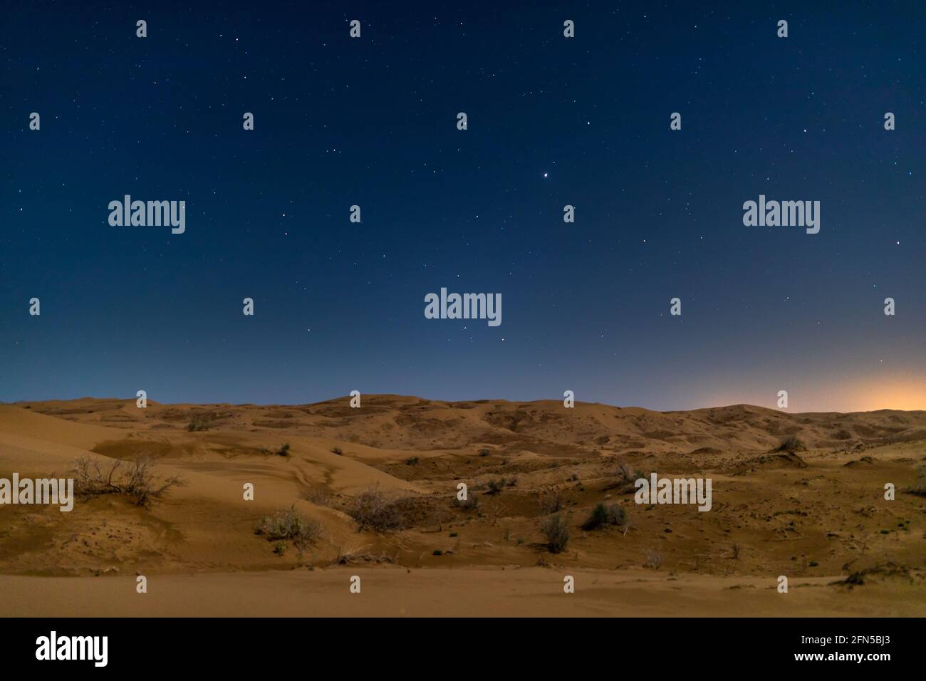 On a desert camping adventure in the desert of Kavir in Iran on a spring full moon night Stock Photo