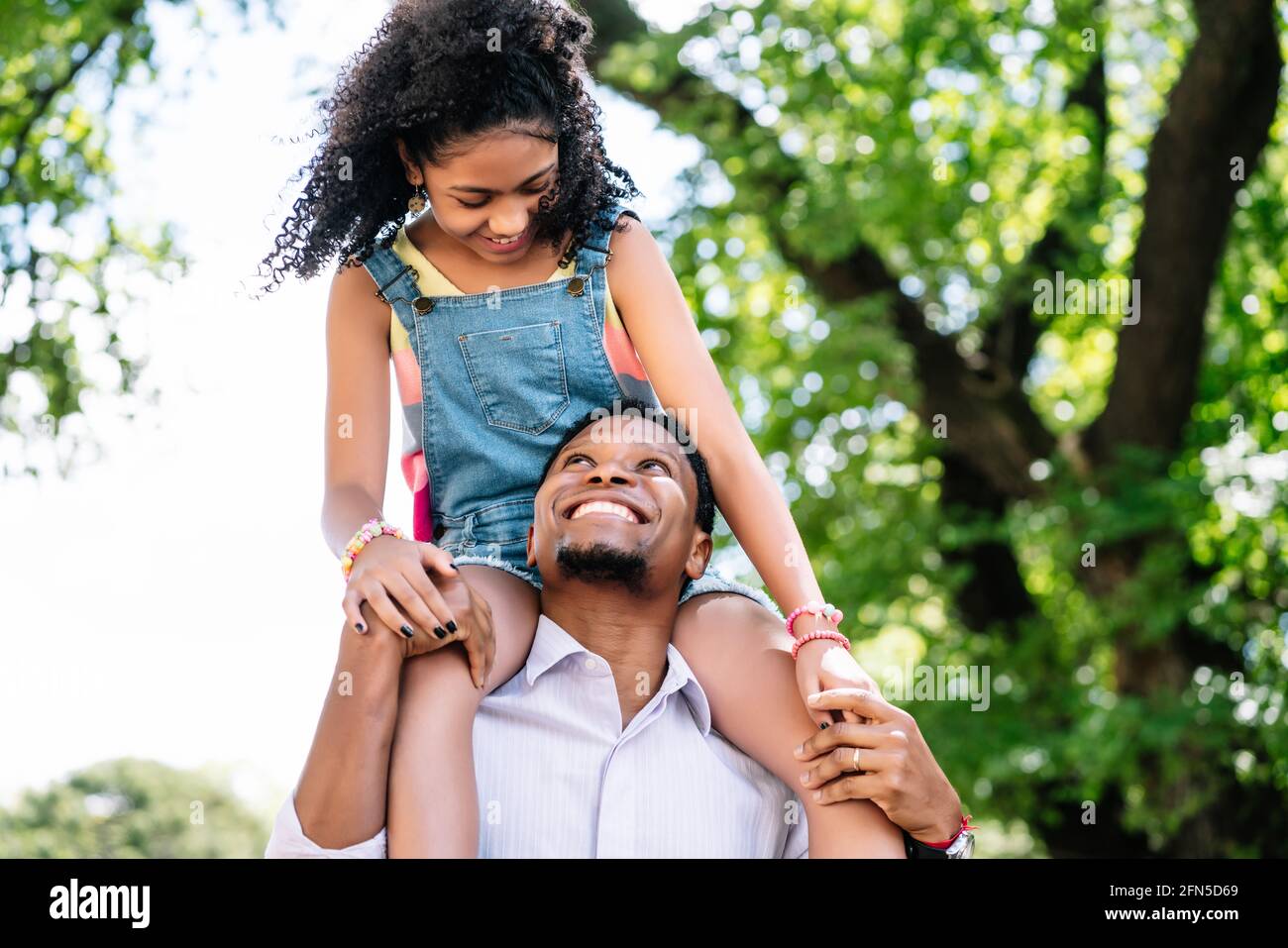 Father and daughter having fun together outdoors Stock Photo - Alamy