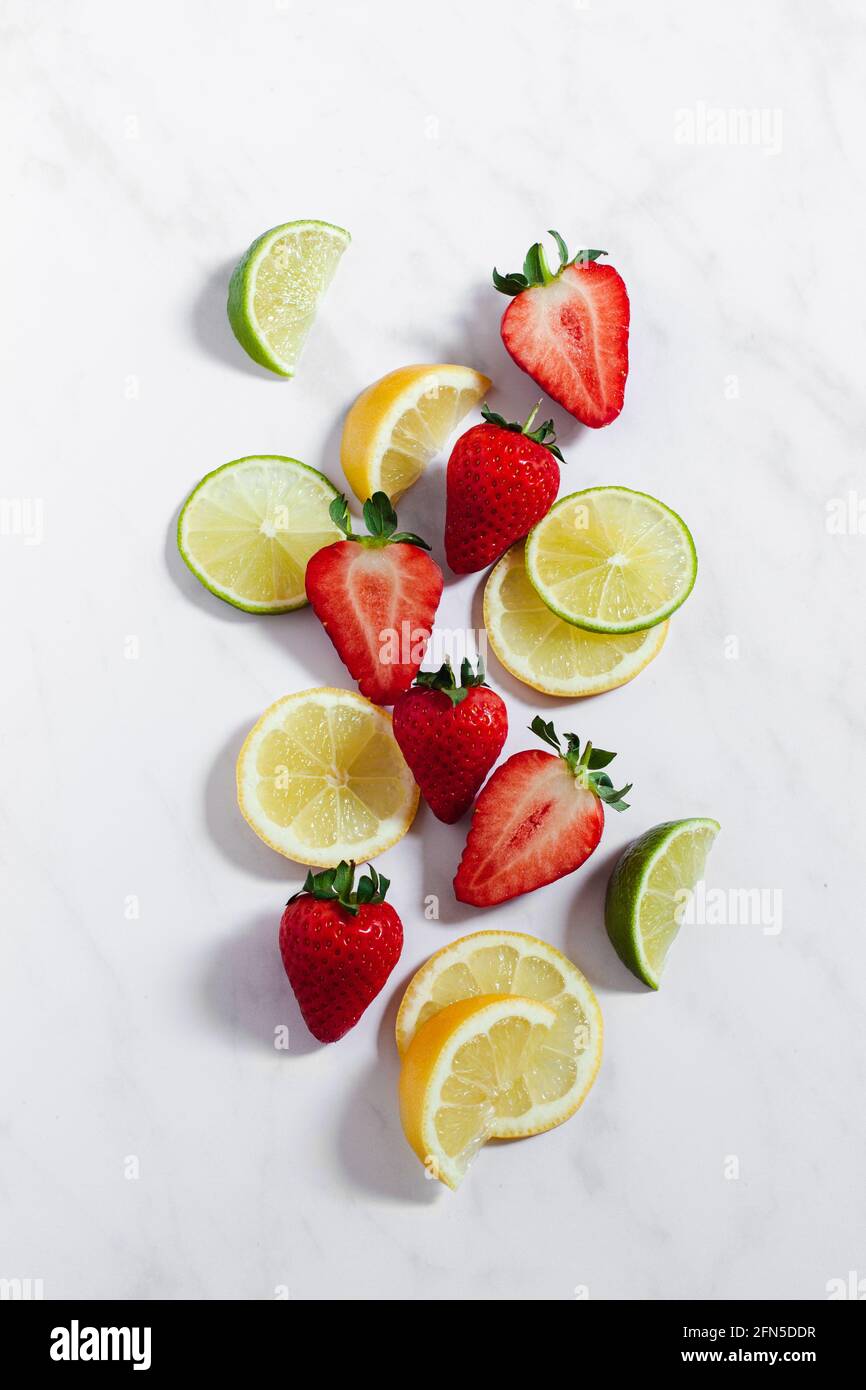 Strawberries and citrus fruit for a berry lemonade. Stock Photo