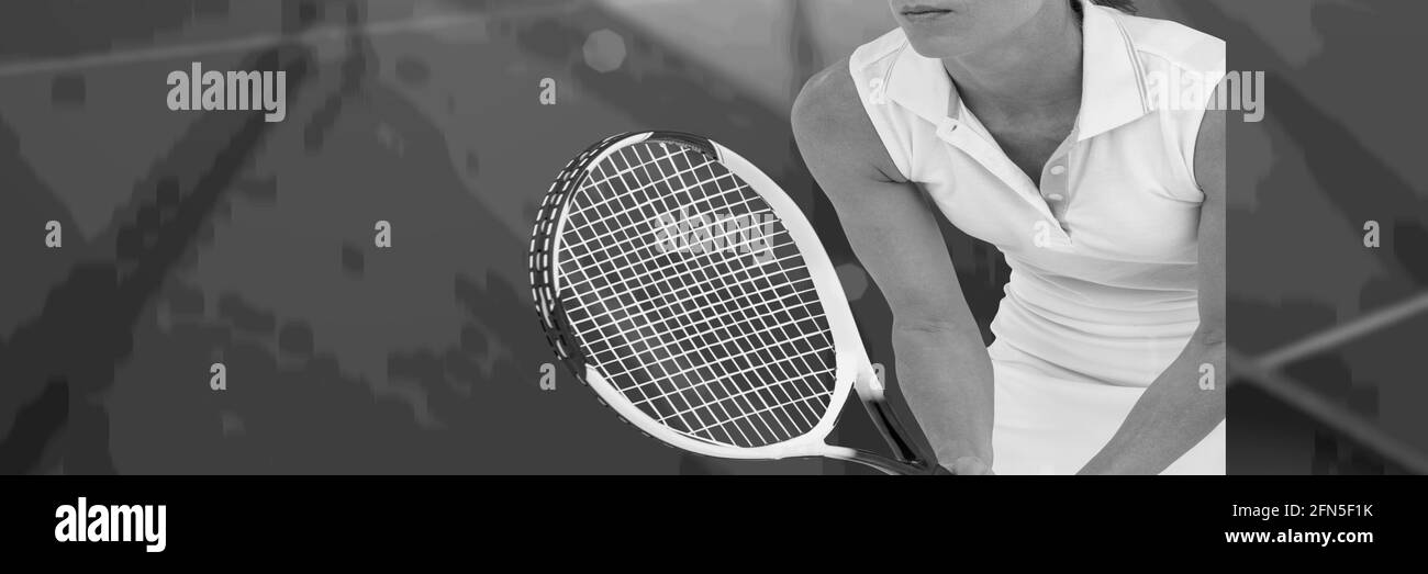 Composition of midsection of woman playing tennis in black and white Stock Photo