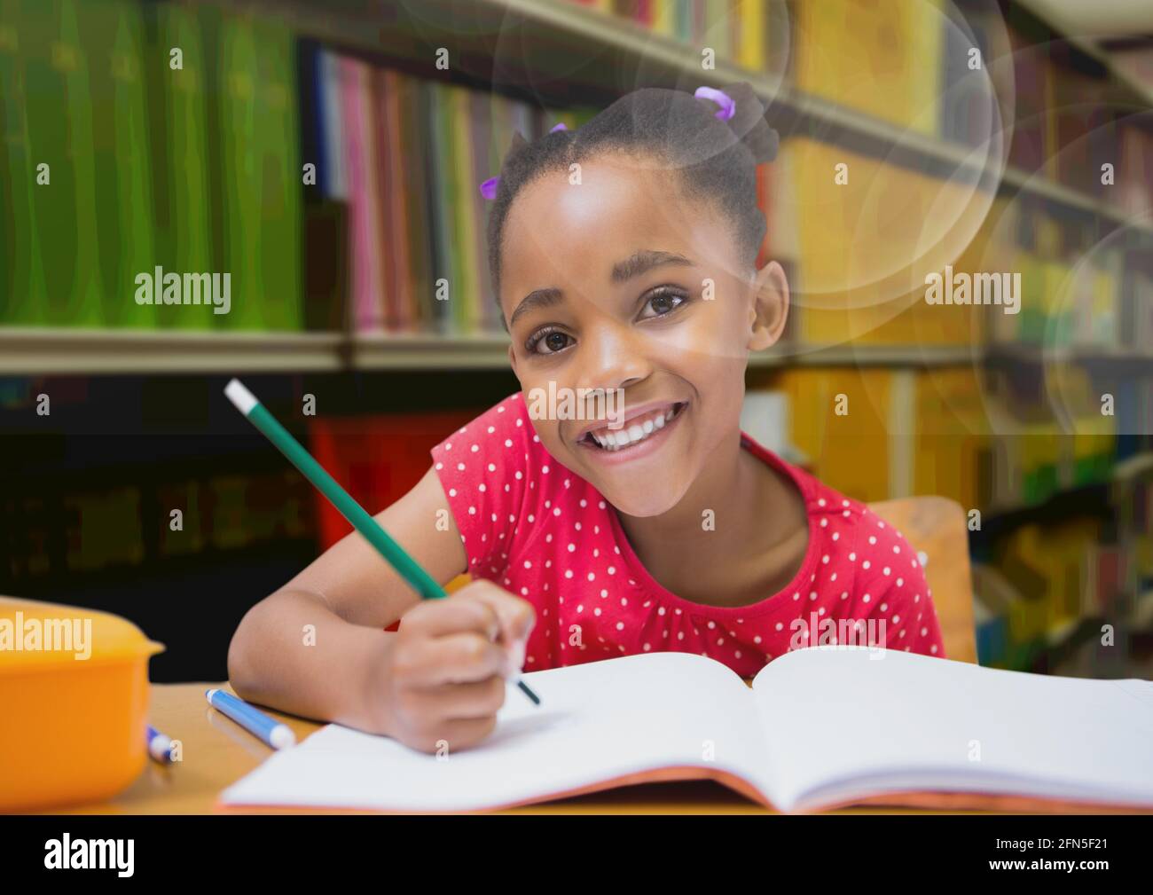 Composition of smiling african american schoolgirl in library with ...
