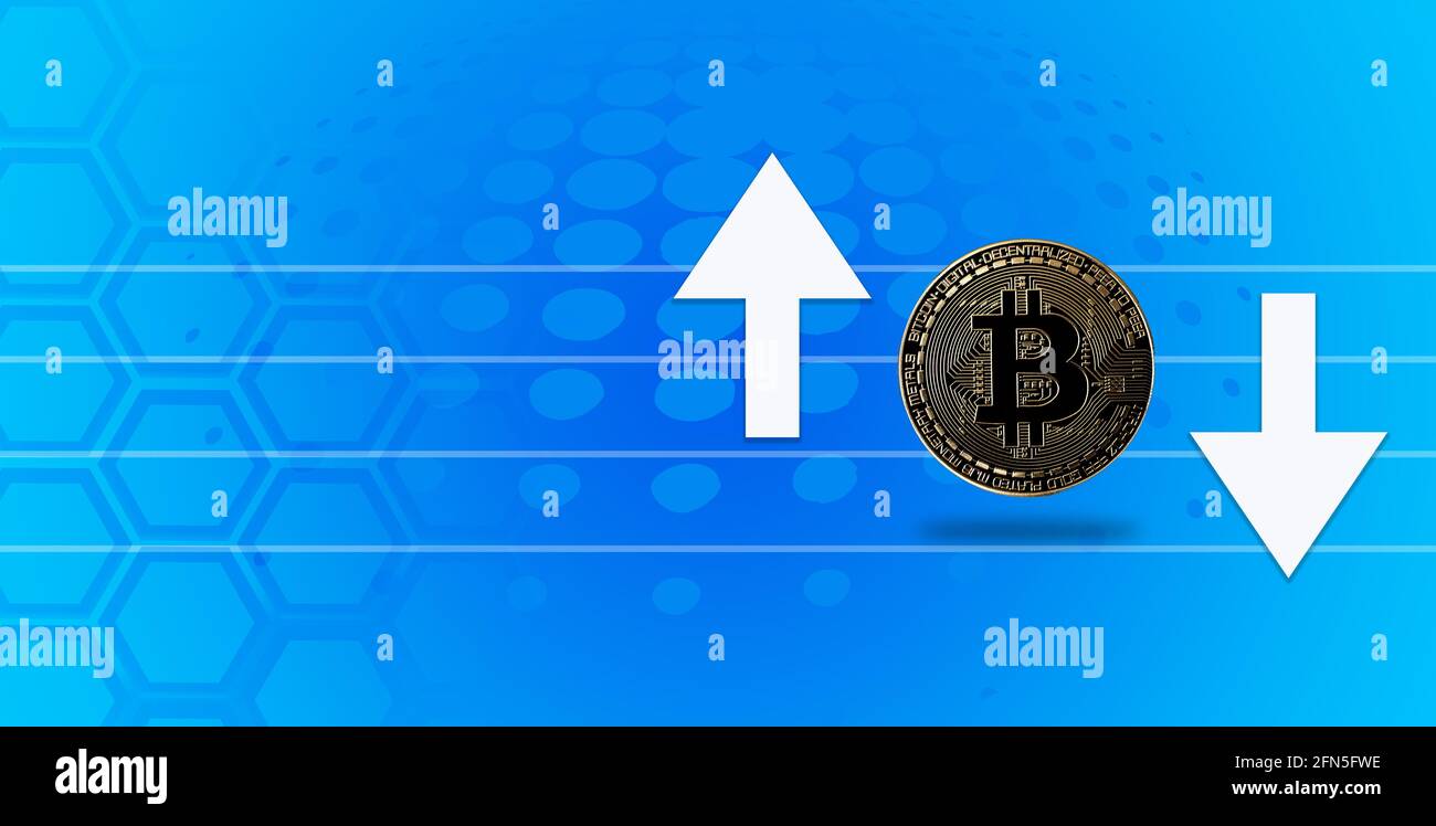 Physical metal bitcoin with global trading exchange market price chart in the background. Stock Photo