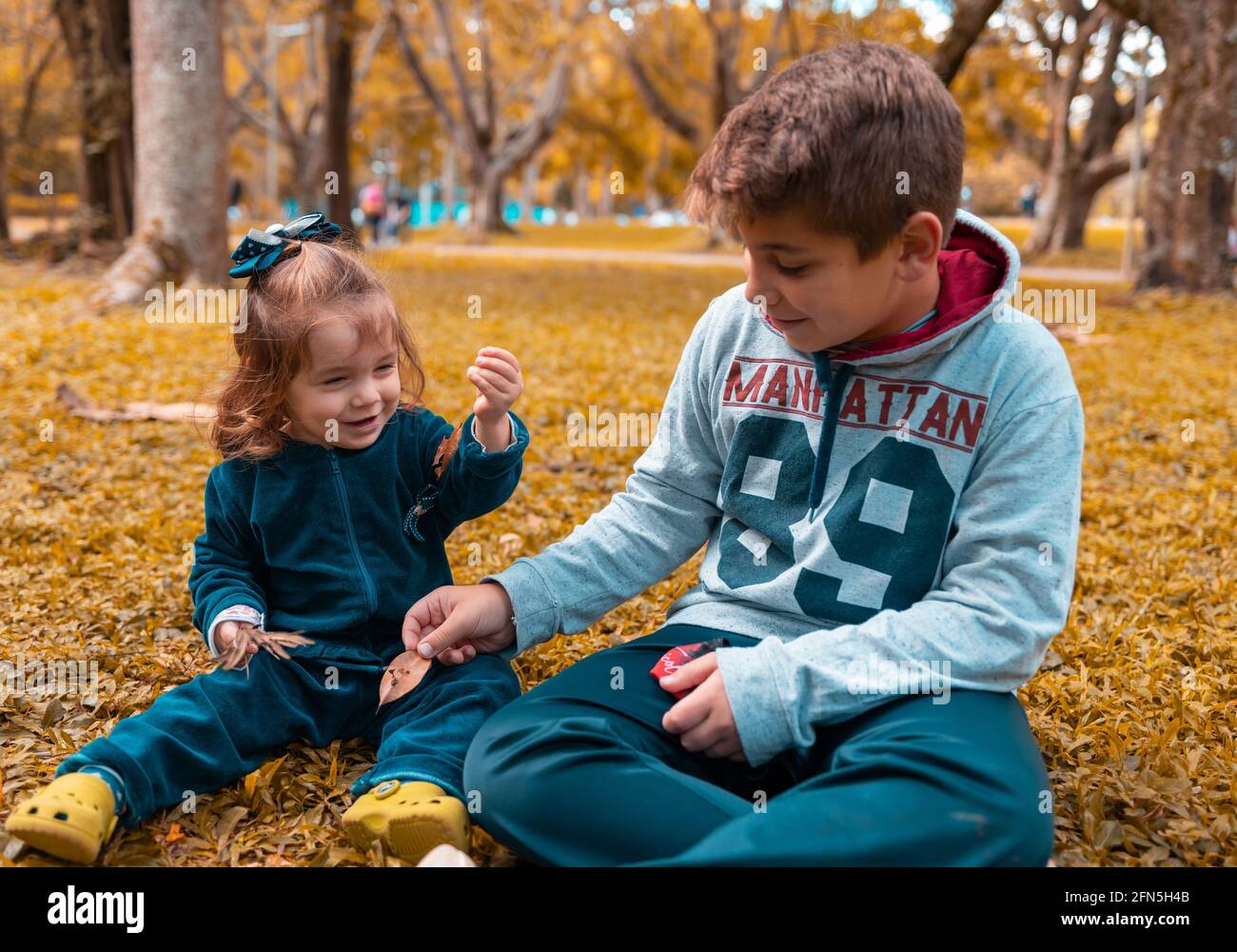 Happy brother sister in park hi-res stock photography and images - Alamy