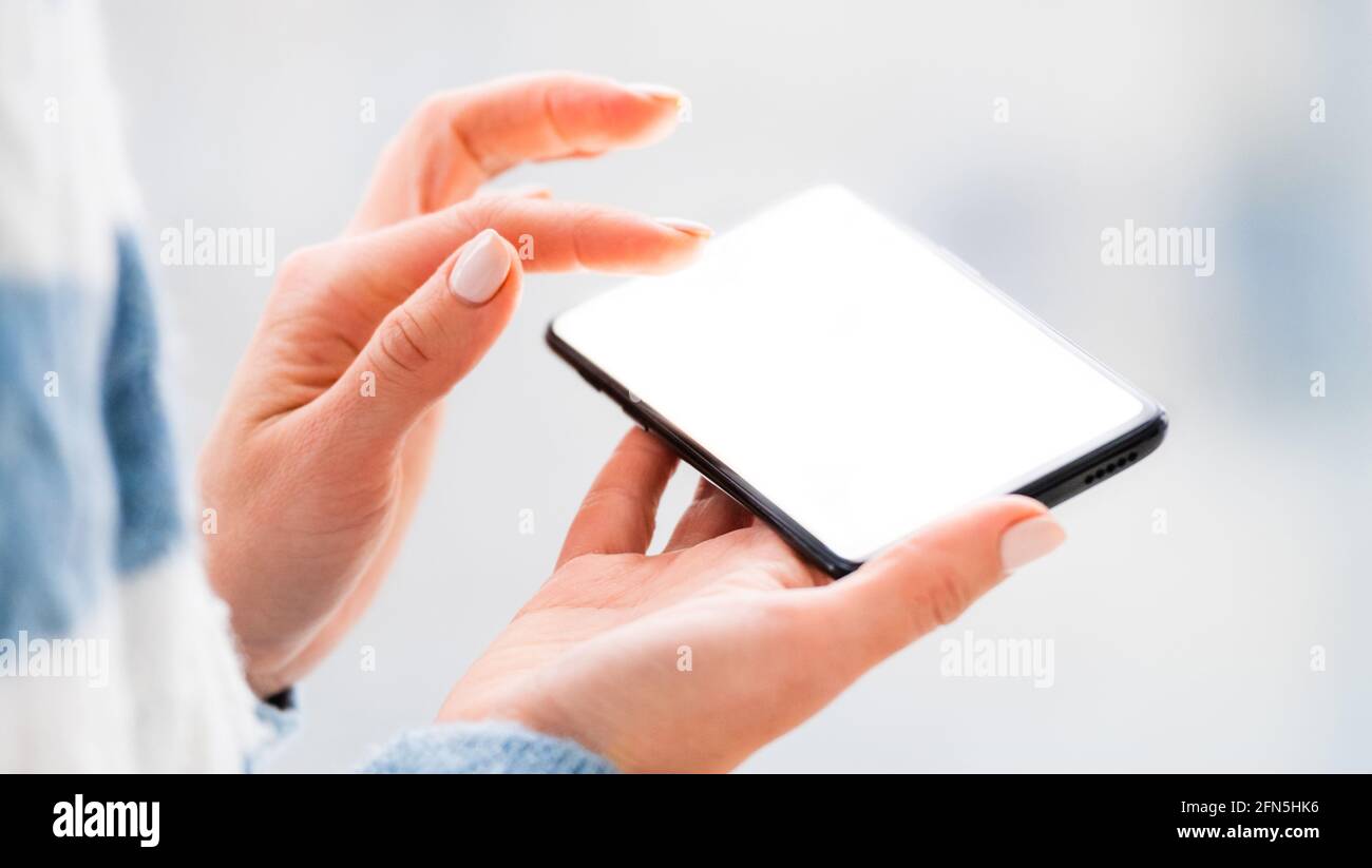 Hands working on mobile phone close up Stock Photo