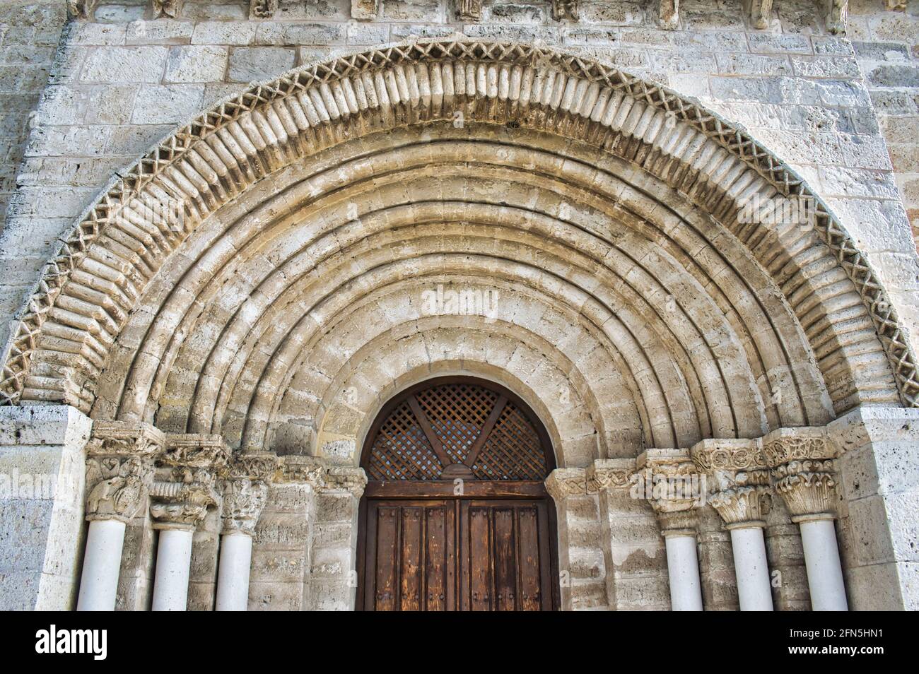 Door and facade of the ancient 12th century Parish Church San Juan Evangelista in Valladolid Stock Photo