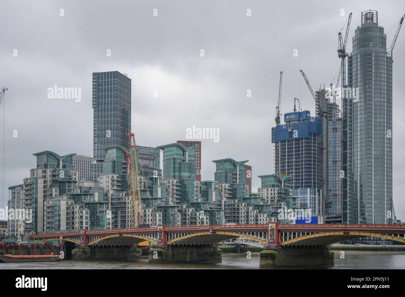 Medium and high rise housing on the south bank of the river Thames at Vauxhall with Vauxhall Bridge in foreground, London, 14 May 2021 Stock Photo
