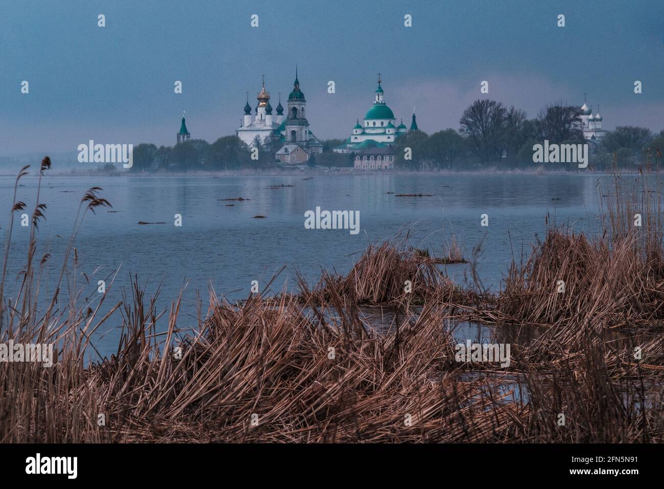 View of Spaso-Yakovlevsky Monastery in Rostov Veliky from Nero's lake on a sunset Stock Photo