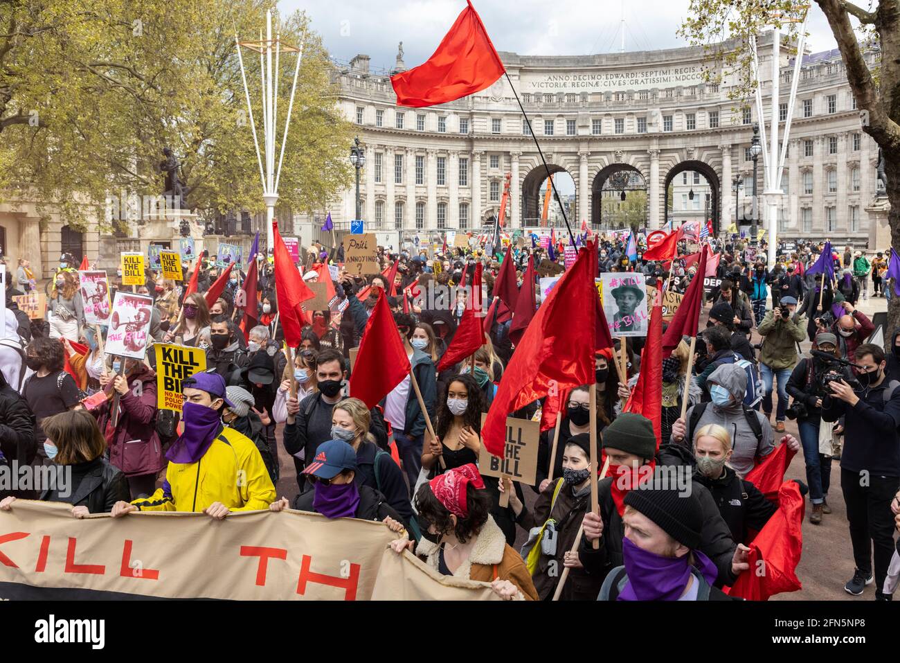 Marching crowd with flags and placards during 'Kill the Bill' protest against new policing bill, London, 1 May 2021 Stock Photo