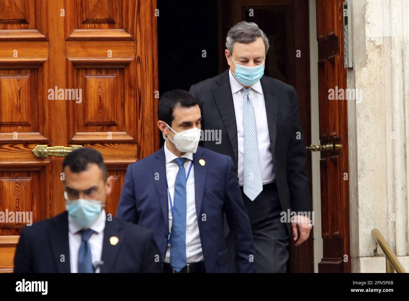 Rome, Italy. 14th May, 2021. ROME, Italy - 14.5.2021: Mario Draghi, the premier of the Italian government, leaves home, accompanied by the escort, to go to Palazzo Chigi, greets the photographers. Credit: Independent Photo Agency/Alamy Live News Stock Photo