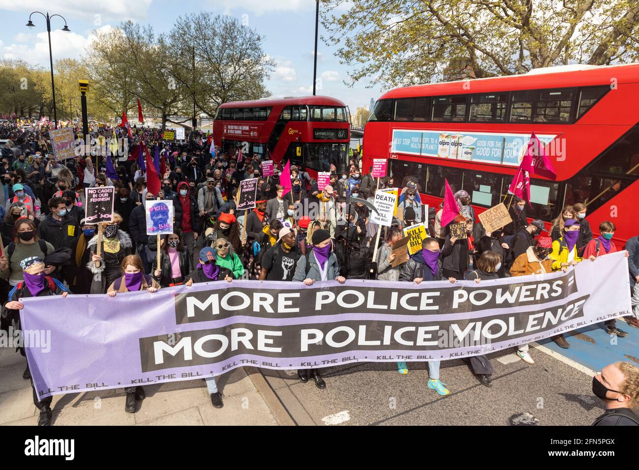 Protesters marching with banner and placards during 'Kill the Bill' protest against new policing bill, London, 1 May 2021 Stock Photo