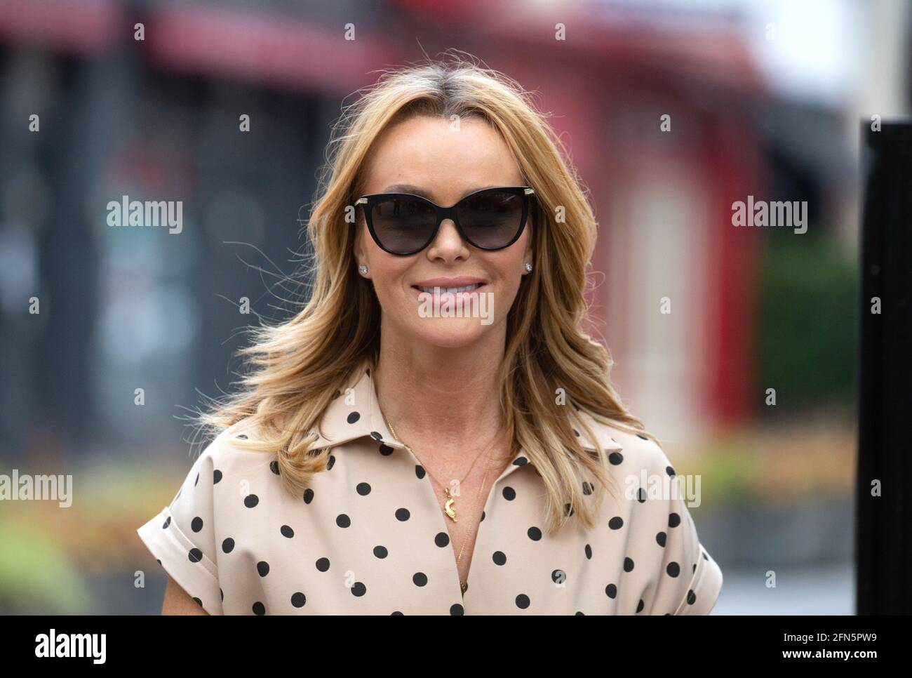 London, UK. 14th May, 2021. Amanda Holden leaves the offices of Global