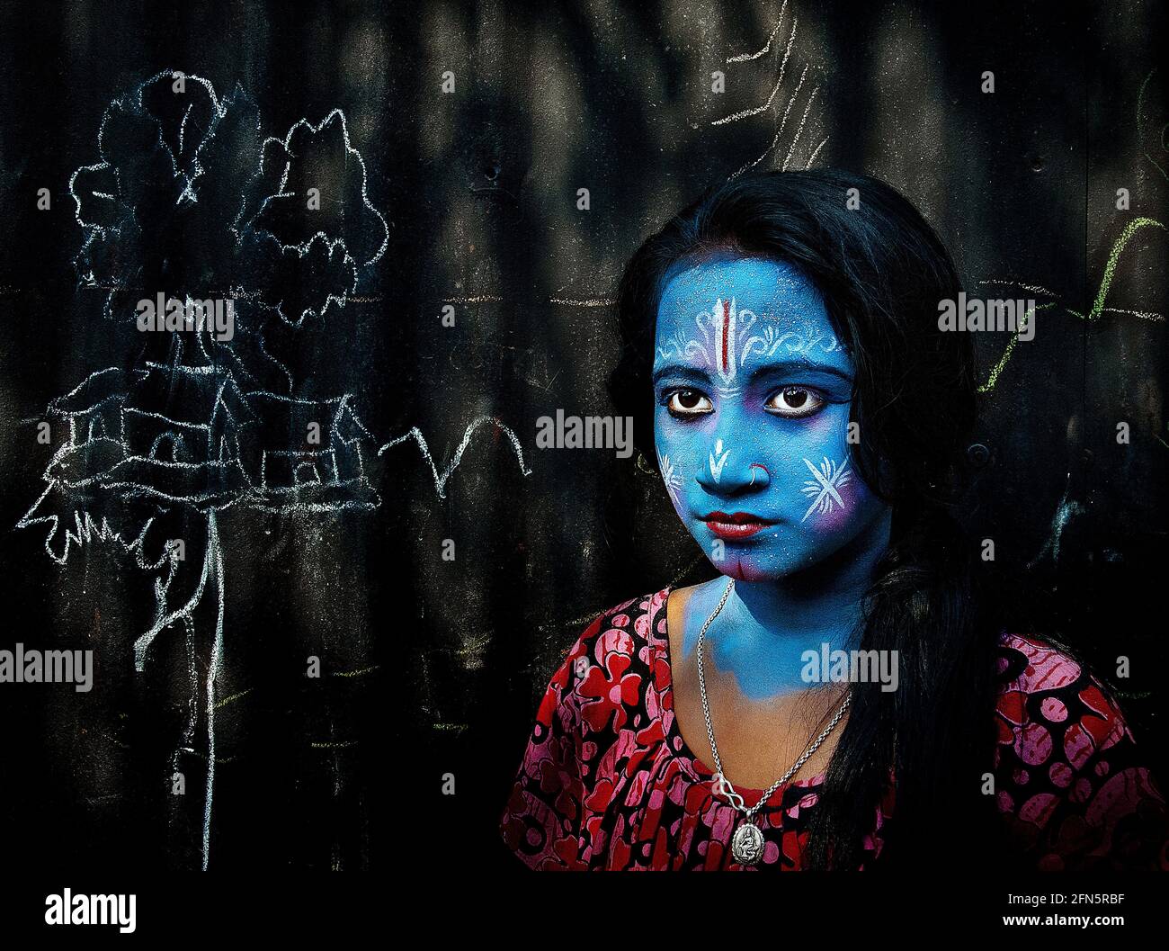 This blue lady celebrates Lord Krishna. INDIA: JOYFUL images have