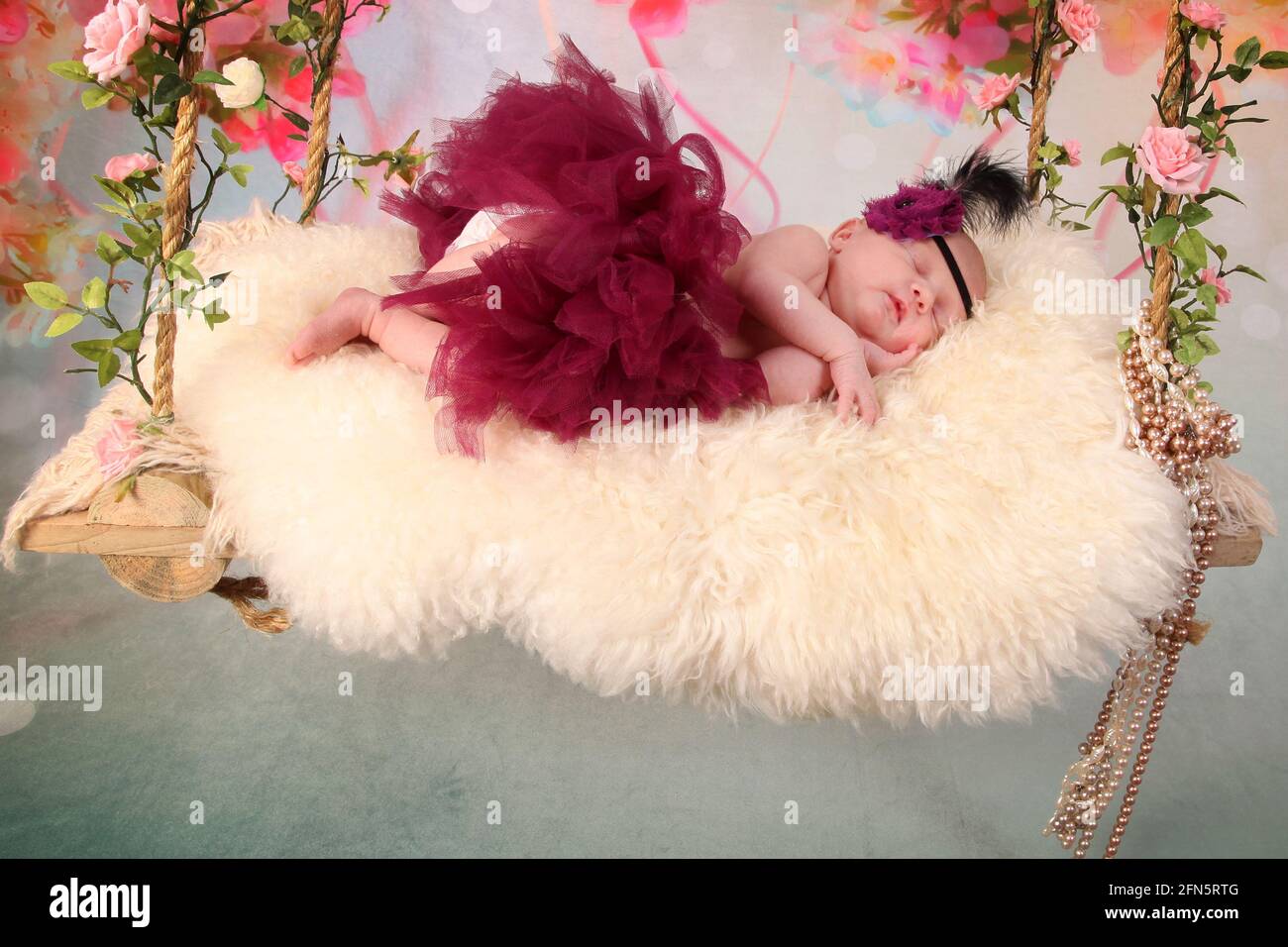 newborn Baby Sleeping on a swing, dreaming, restful sleep in a dream