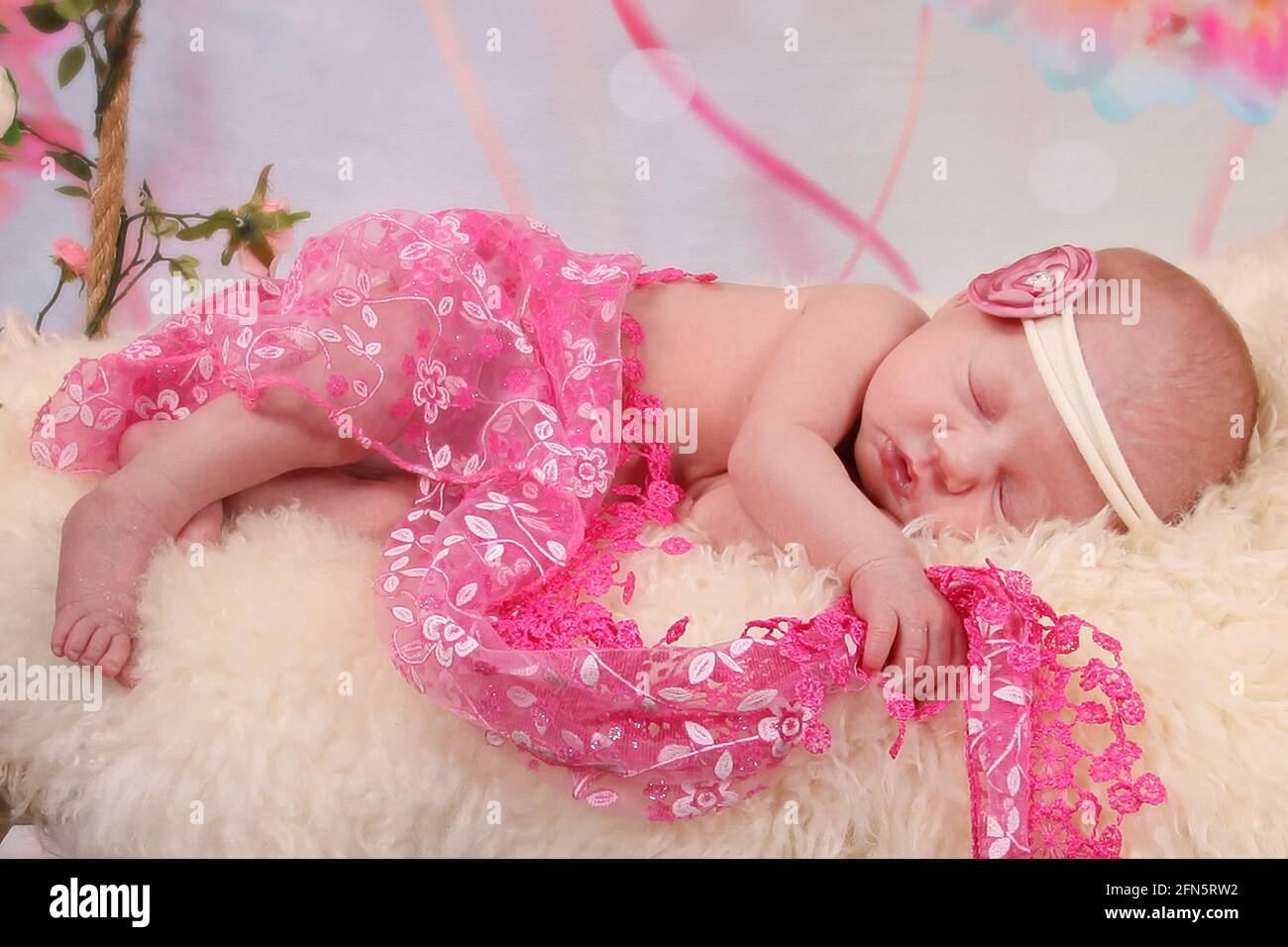 newborn Baby Sleeping on a swing, dreaming, restful sleep in a dream