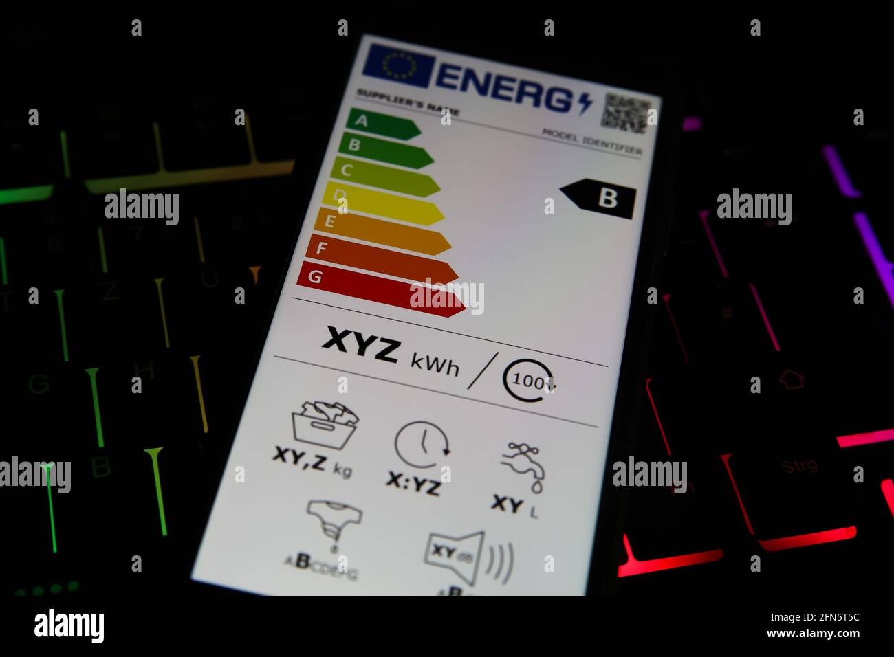 Viresen, Germany - May 8. 2021: Closeup of mobile phone screen with new european union energy label efficiency classes A - D, illuminated computer key Stock Photo