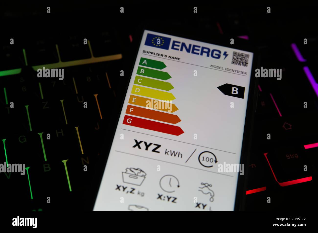Viresen, Germany - May 8. 2021: Closeup of mobile phone screen with new european union energy label efficiency classes A - D, illuminated computer key Stock Photo